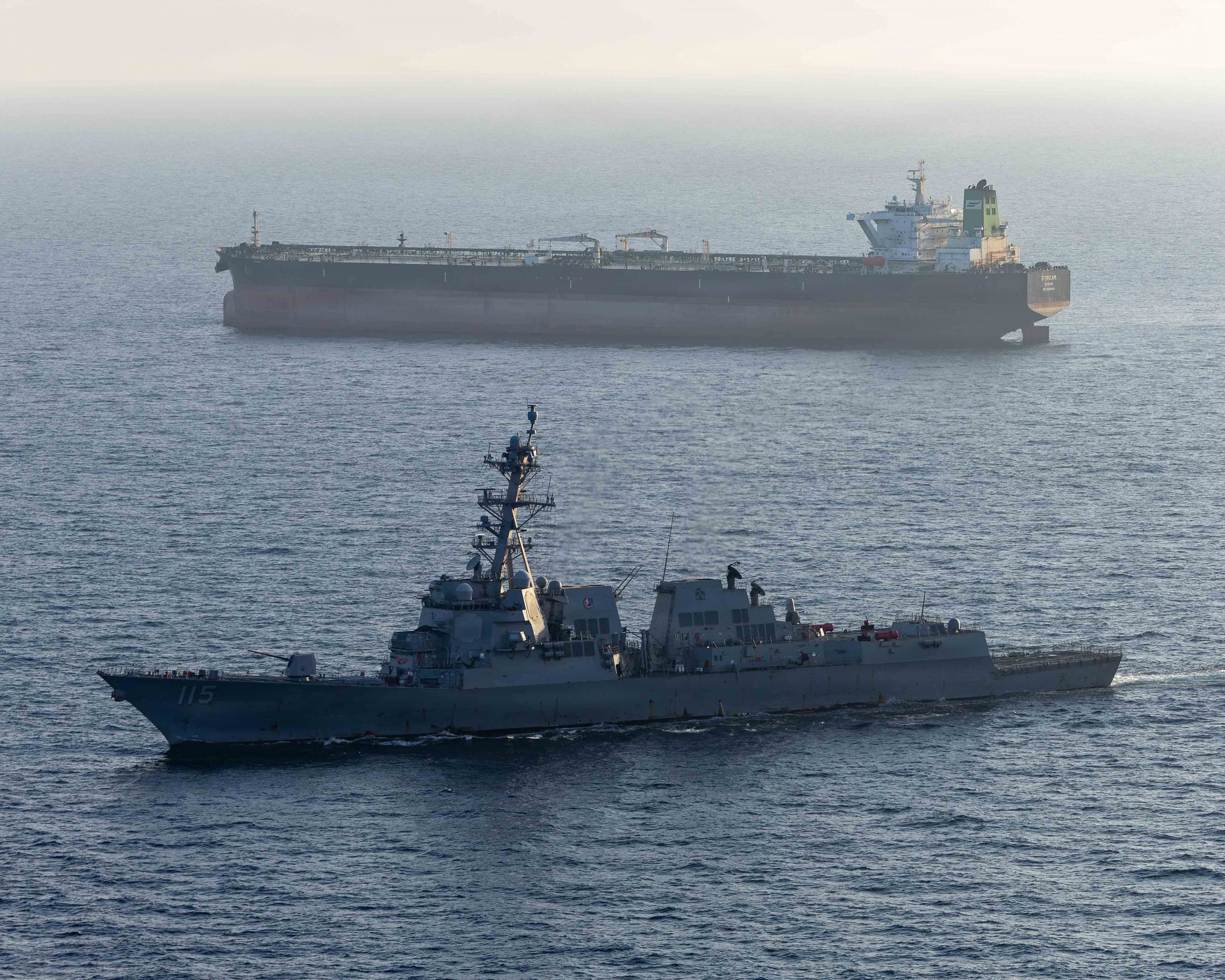 In this handout photo provided by U.S. Central Command, Arleigh Burke-class guided-missile destroyer USS Rafael Peralta (DDG 115) implements a maritime blockade against an Iranian-flagged ship attempting to sail toward an Iranian port