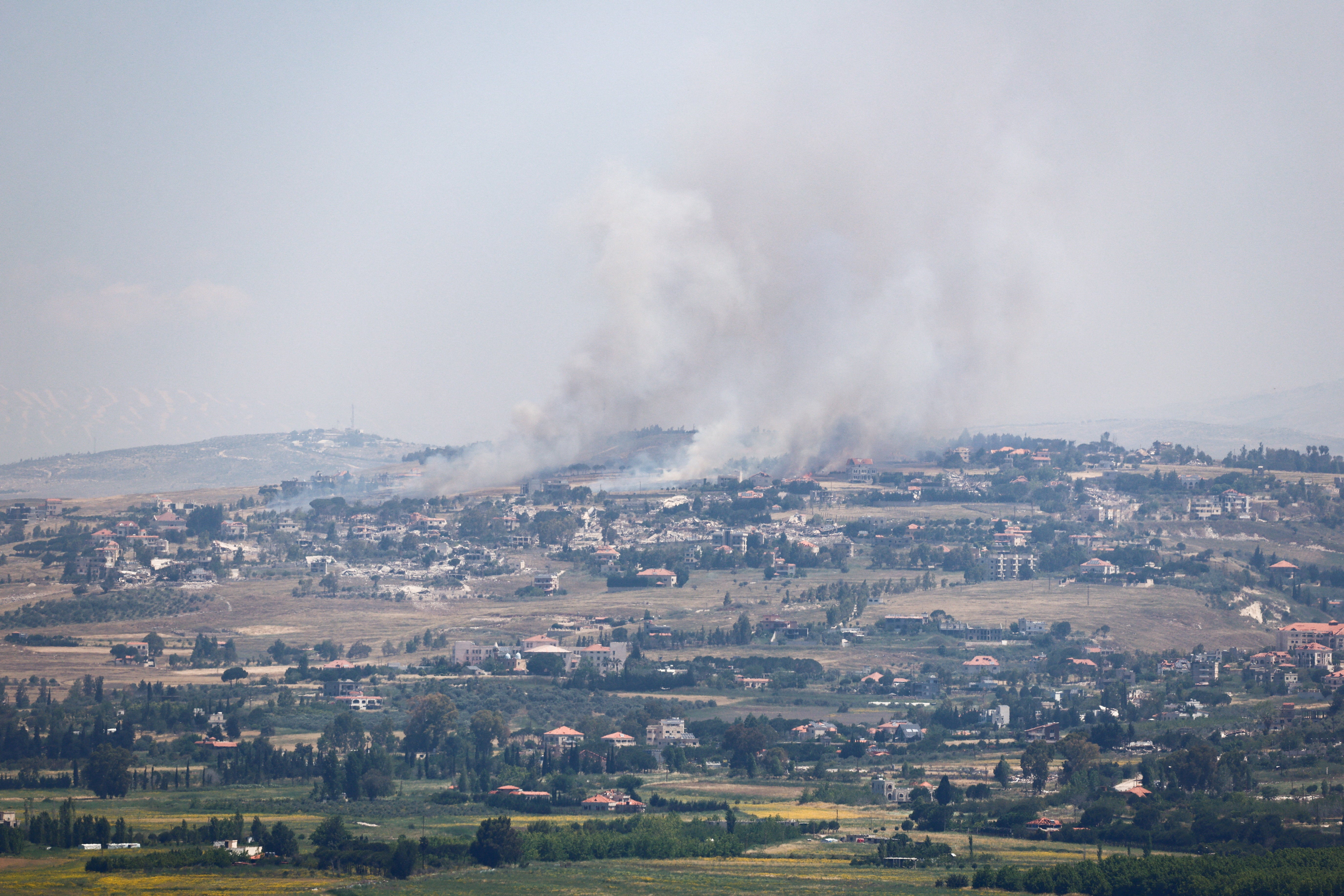 Smoke rises in Lebanon, as seen from the Israeli side of the border, on 1 June