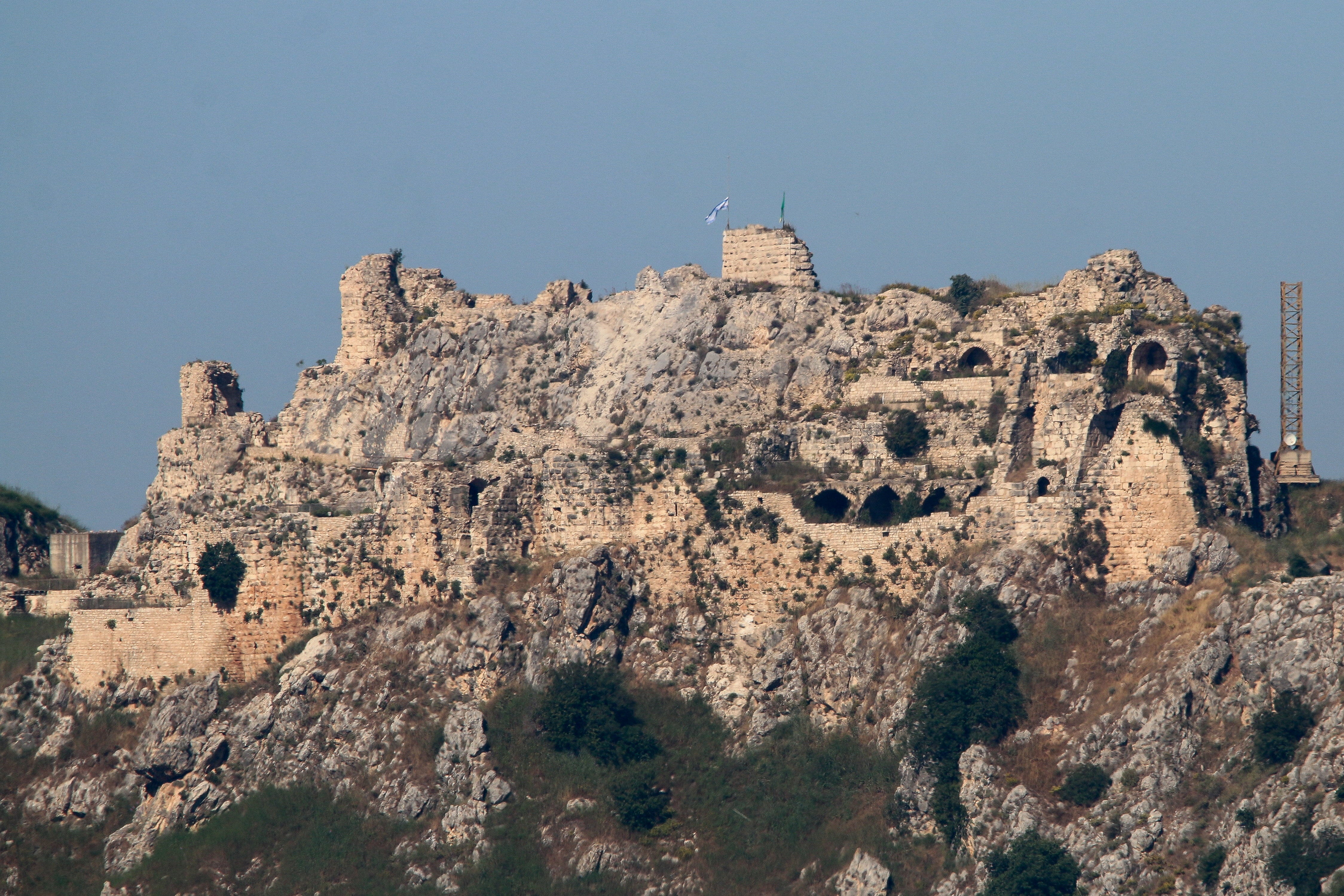 An Israeli flag and a flag of the Golani Brigade fly on Beaufort Castle, as seen from Marjayoun, southern Lebanon, on 1 June