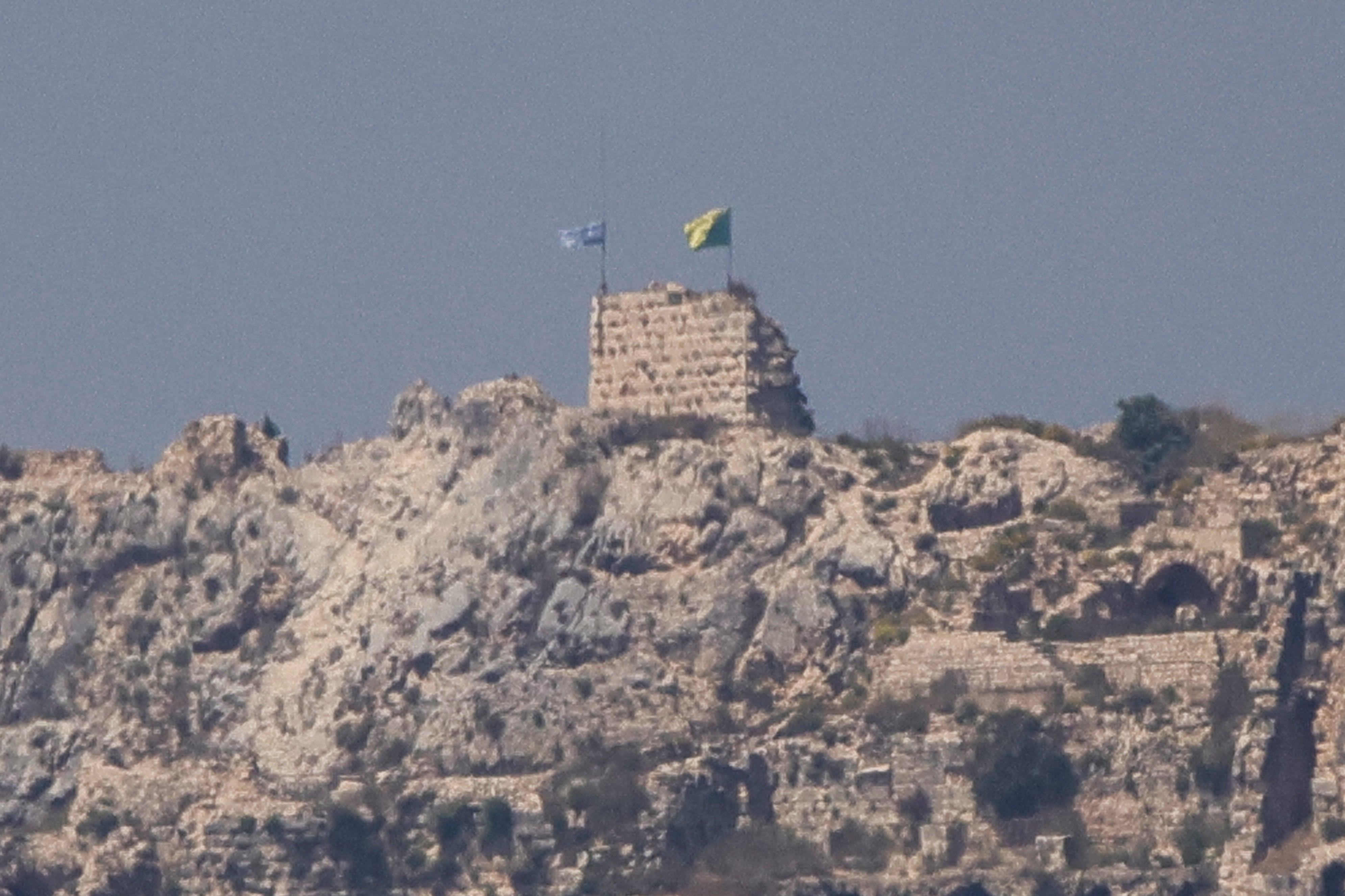 This picture taken from Marjayoun, southern Lebanon, shows an Israeli flag and a Golani Brigade flag fluttering atop the medieval Beaufort Castle in Arnoun on June 1, 2026. (AFP/Getty)