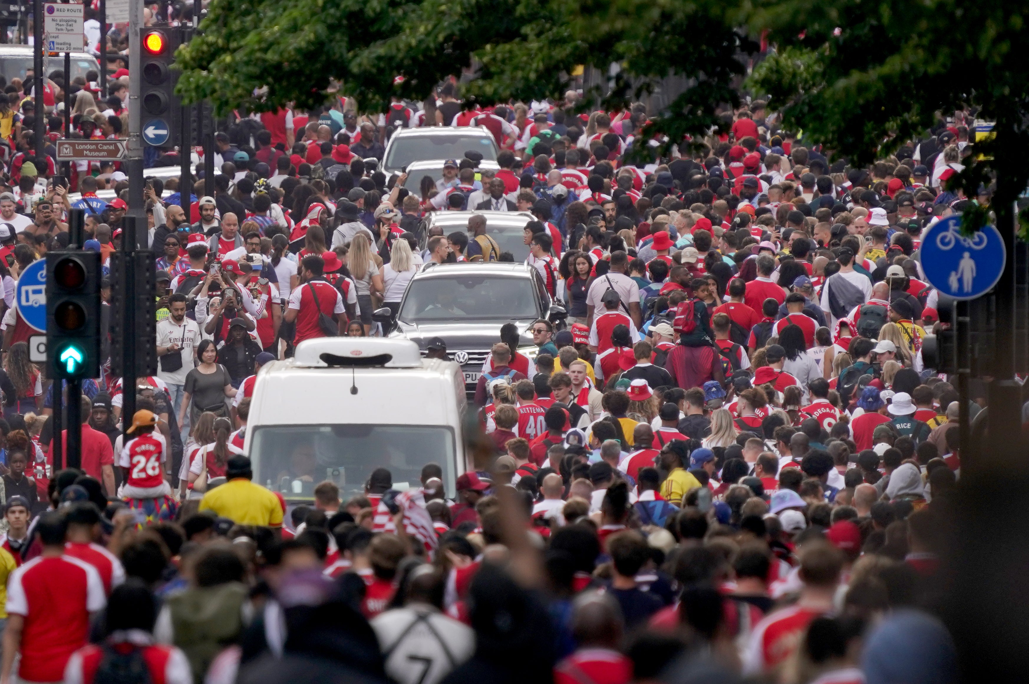 Arsenal fans made their way towards King's Cross station following a victory parade to celebrate their club winning the Premier League title
