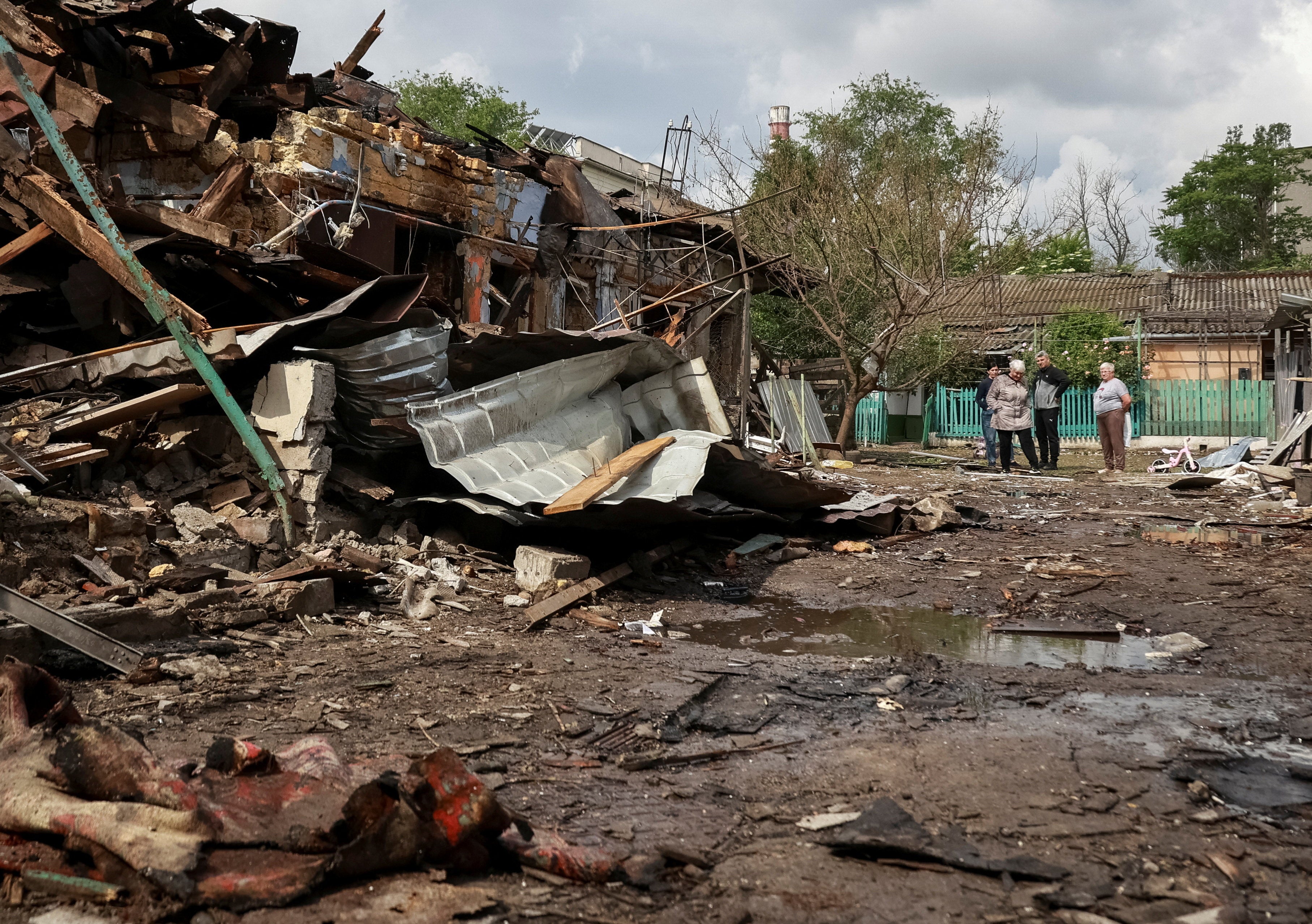 Residents look at houses damaged by a Russian drone strike in Odesa, Ukraine, June 1, 2026