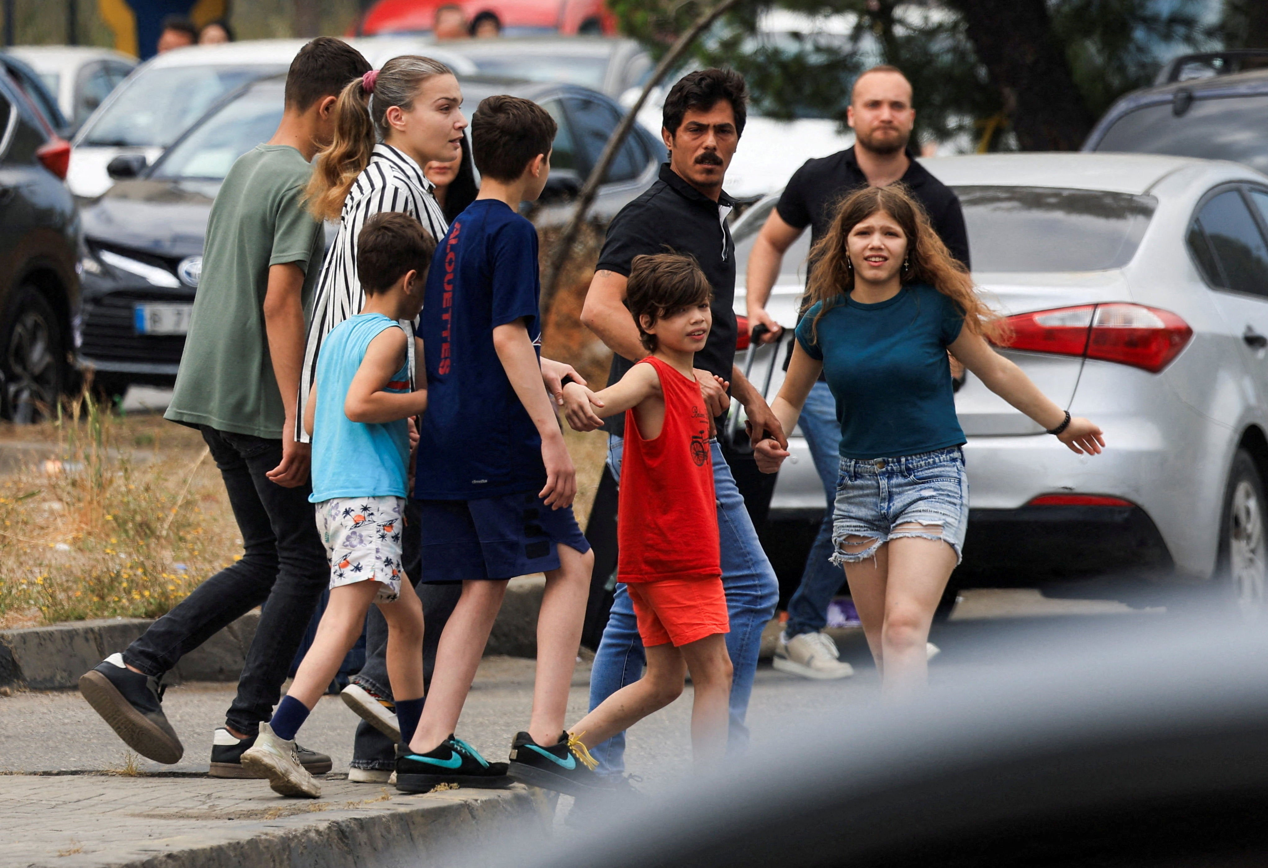 People, including children, walk along a road, as they make their way while fleeing the southern suburbs of Beirut, after Israeli Prime Minister Benjamin Netanyahu ordered the military to attack targets in the suburbs, Lebanon, June 1, 2026. (Reuters)