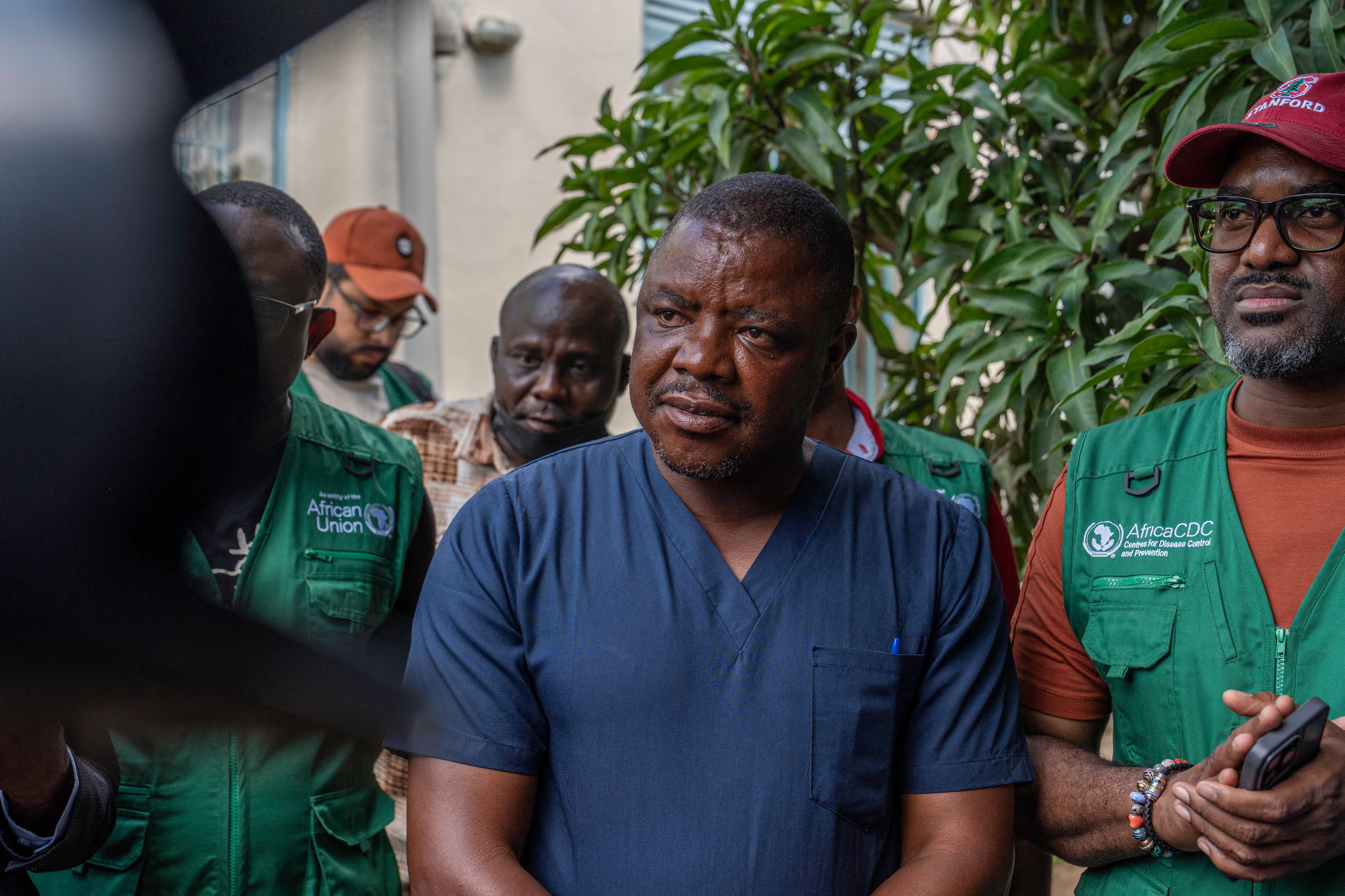 Ezo Étienne, a doctor who has recovered from Ebola, leaves the treatment center in Bunia, in the northeastern Democratic Republic of the Congo