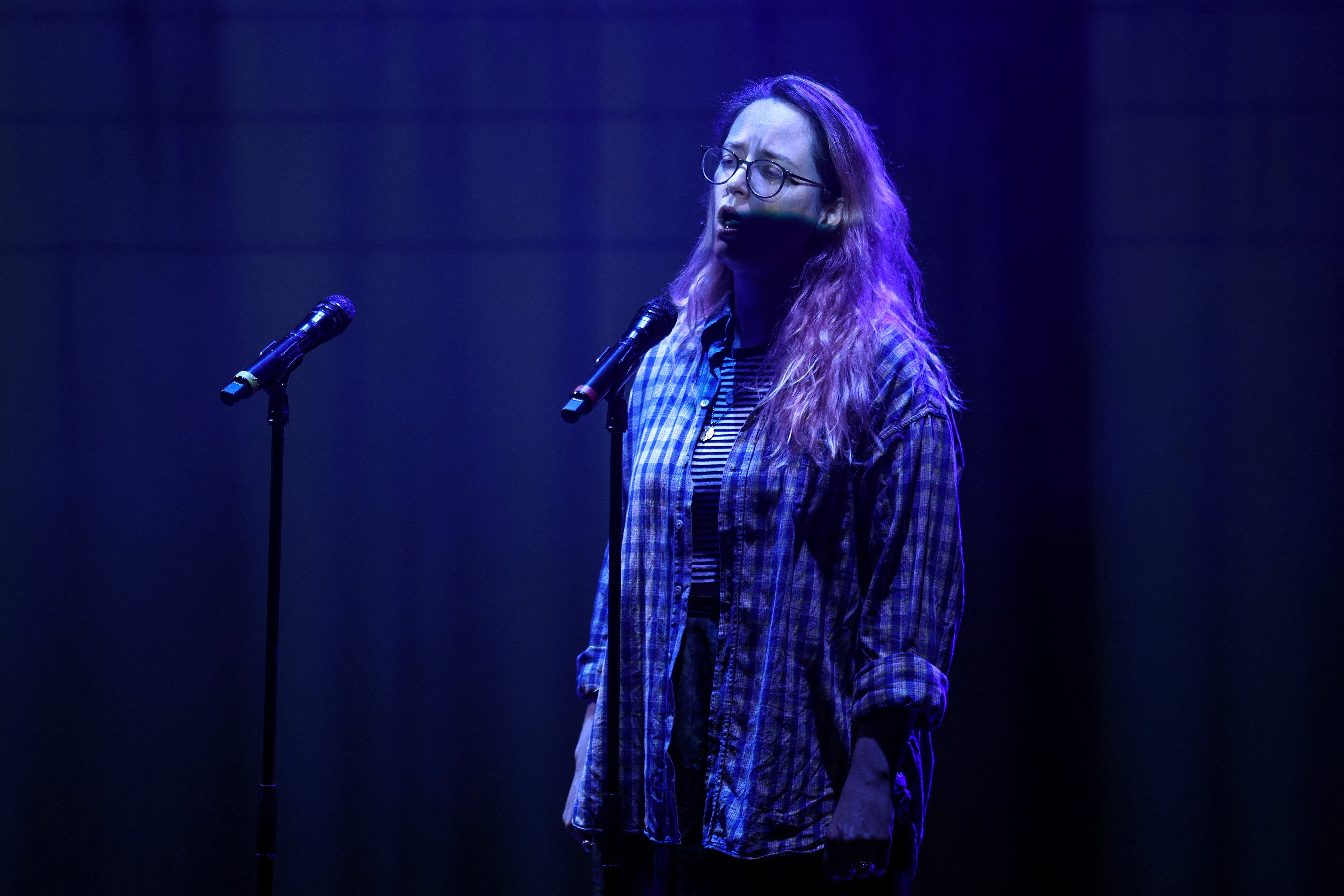 British-Canadian soprano Patricia Auchterlonie performs on stage during a preview rehearsal of the piece "transference" by British artist Harry Yeff (also known by his stage name Reeps100), which uses artificial intelligence (AI) to render the human voice, at the Royal Opera House in central London on May 29, 2026