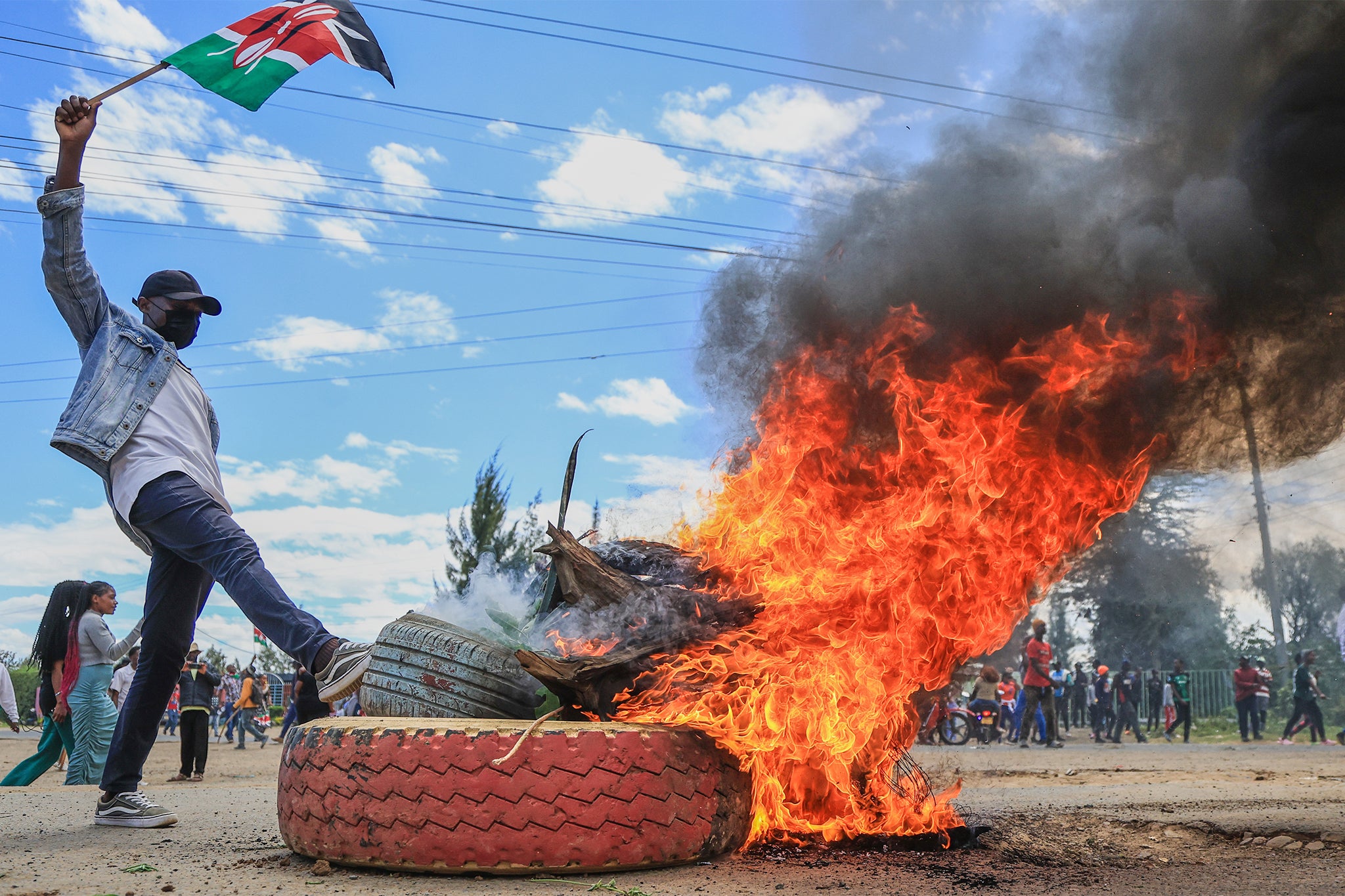 NTV Kenya and Citizen Kenya television channels showed footage of people standing by a wall outside the air base, with a tank stationed there and a handful of soldiers on guard