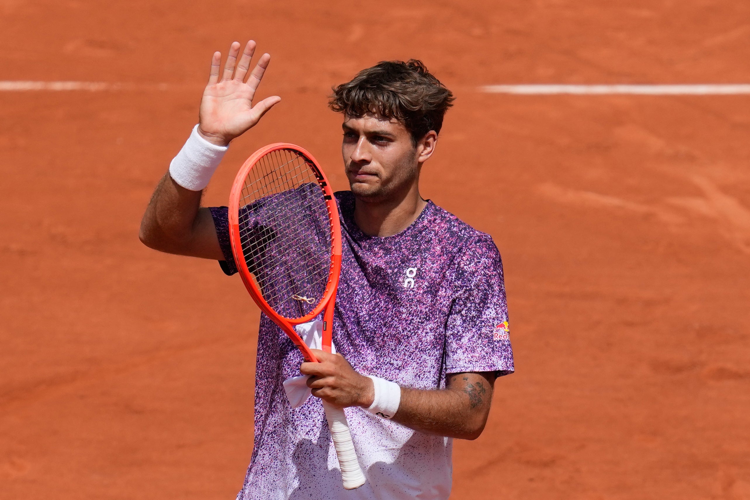 Flavio Cobolli (pictured) saw off Zachary Svajda on Monday (Christophe Ena/AP)