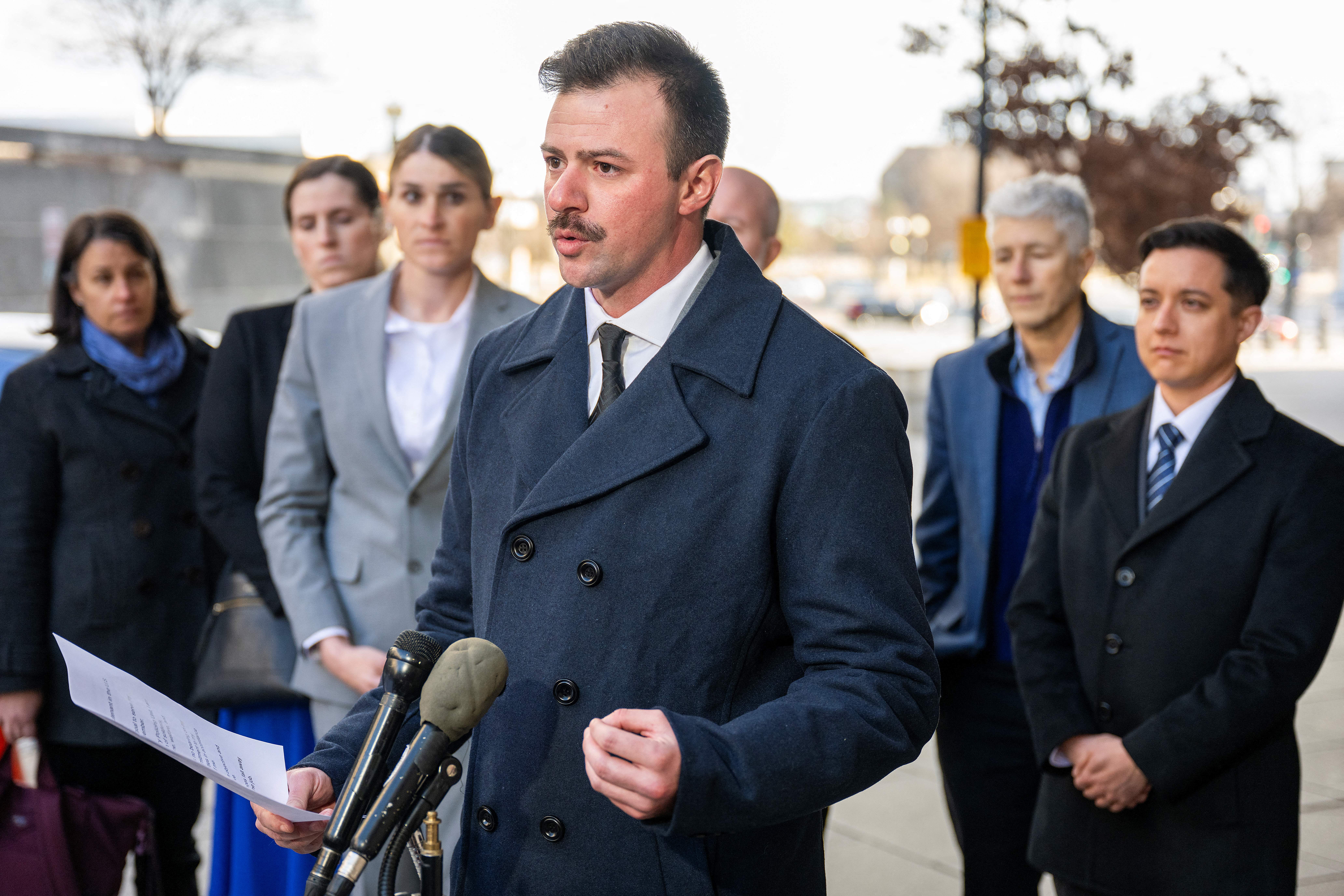 US Army Reserve second lieutenant Nicolas Talbott, center, is the lead plaintiff in a long-running legal battle to block the Trump administration’s anti-trans Pentagon orders (AFP/Getty)