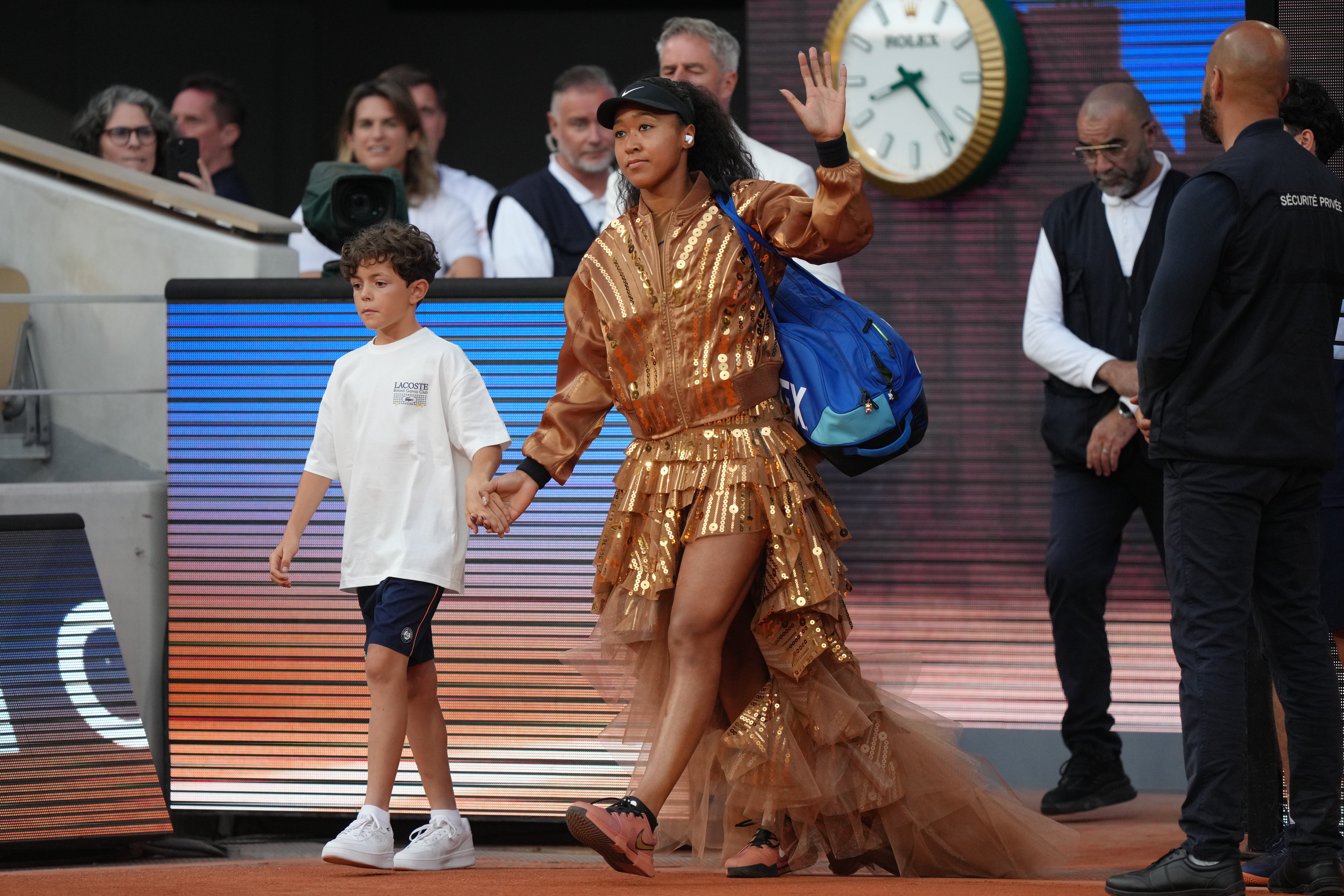 Naomi Osaka walks on to the court for the fourth-round French Open match against Aryna Sabalenka