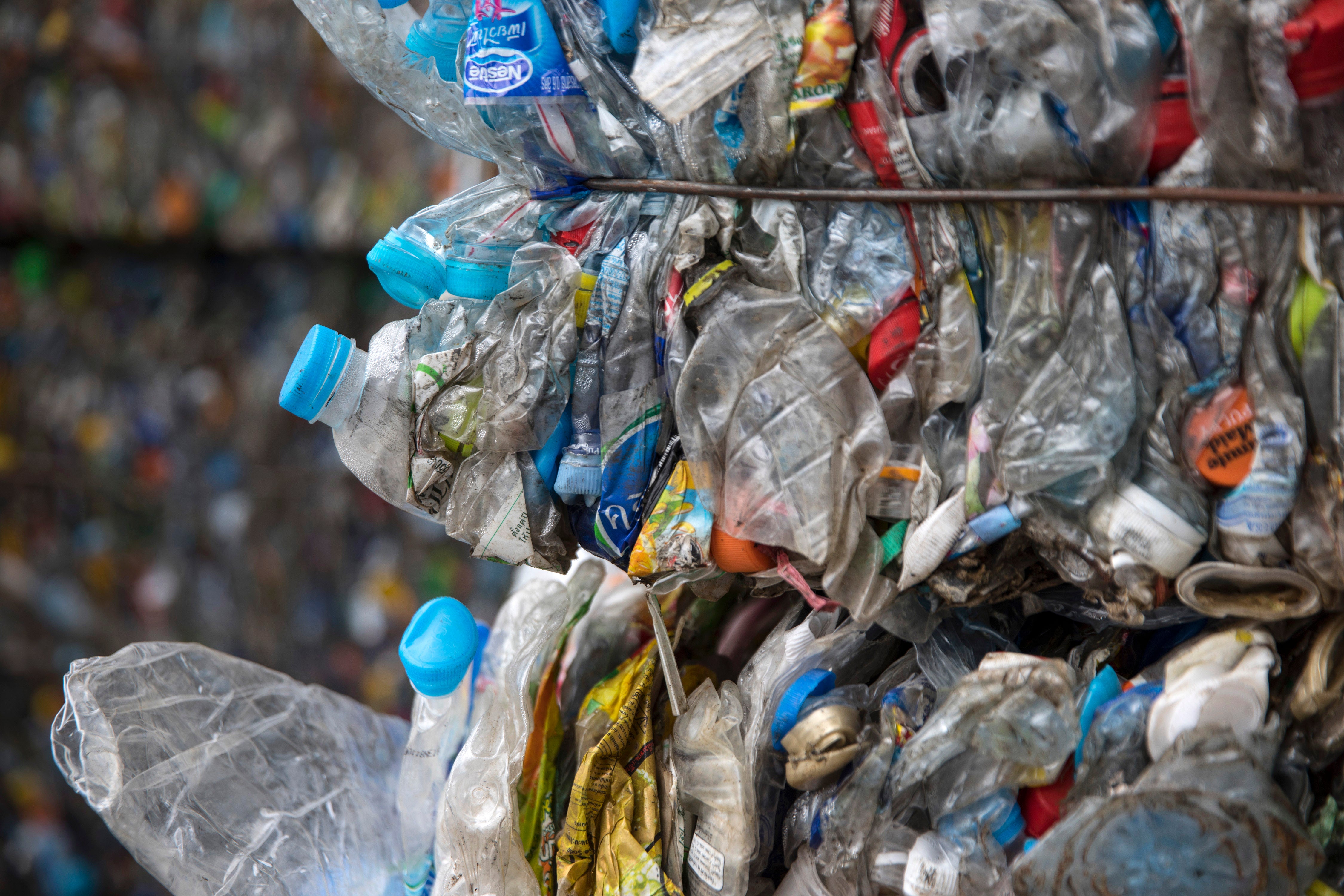 Flattened plastic bottles bottles are stacked in bales for recycling