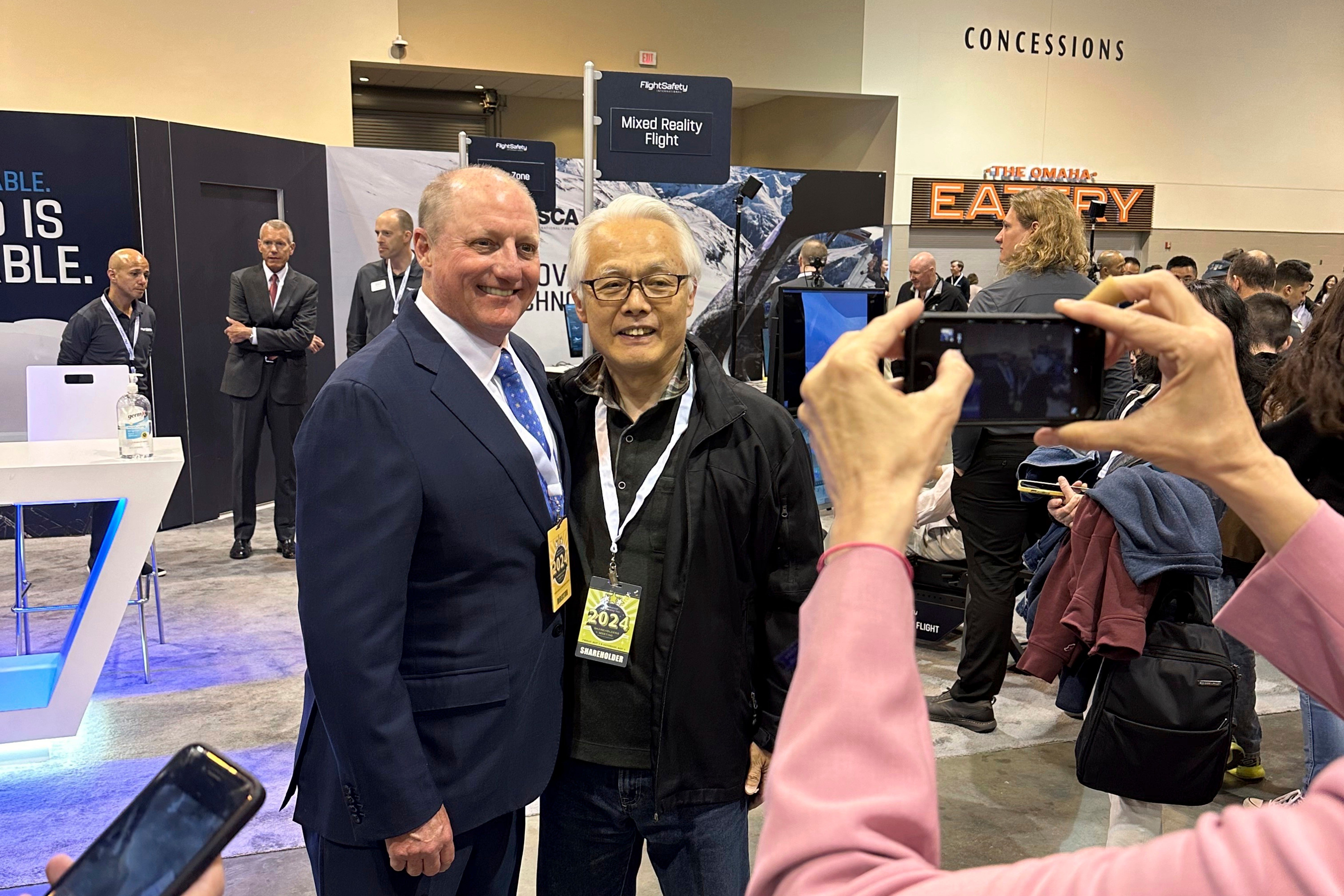 Berkshire Hathaway Vice Chairman Greg Abel poses for pictures with shareholders (Copyright 2026 The Associated Press. All rights reserved.)