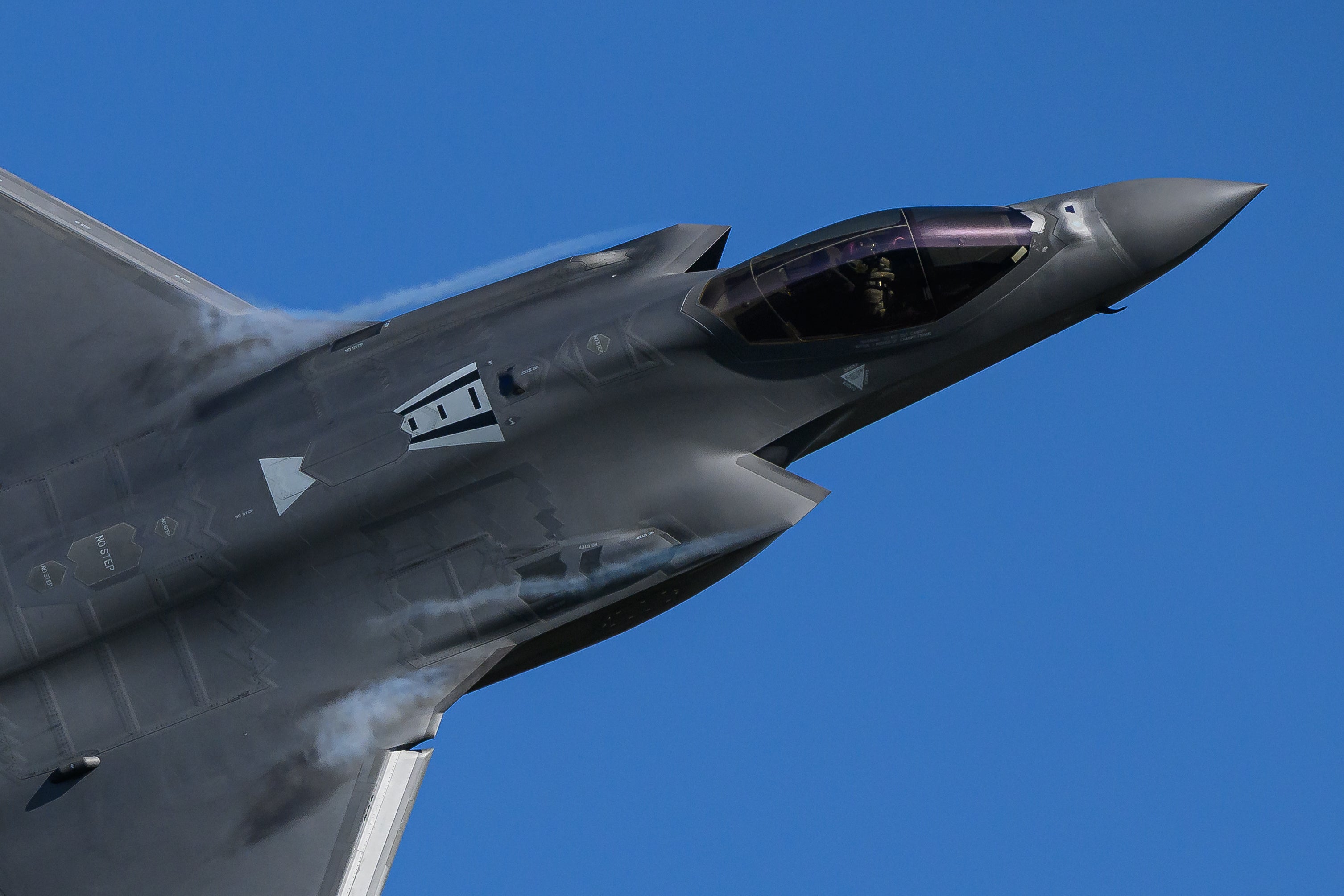 A Lightning II stealth multirole fighter jet overflies RAF Lakenheath on April 08, 2026 in Lakenheath, England