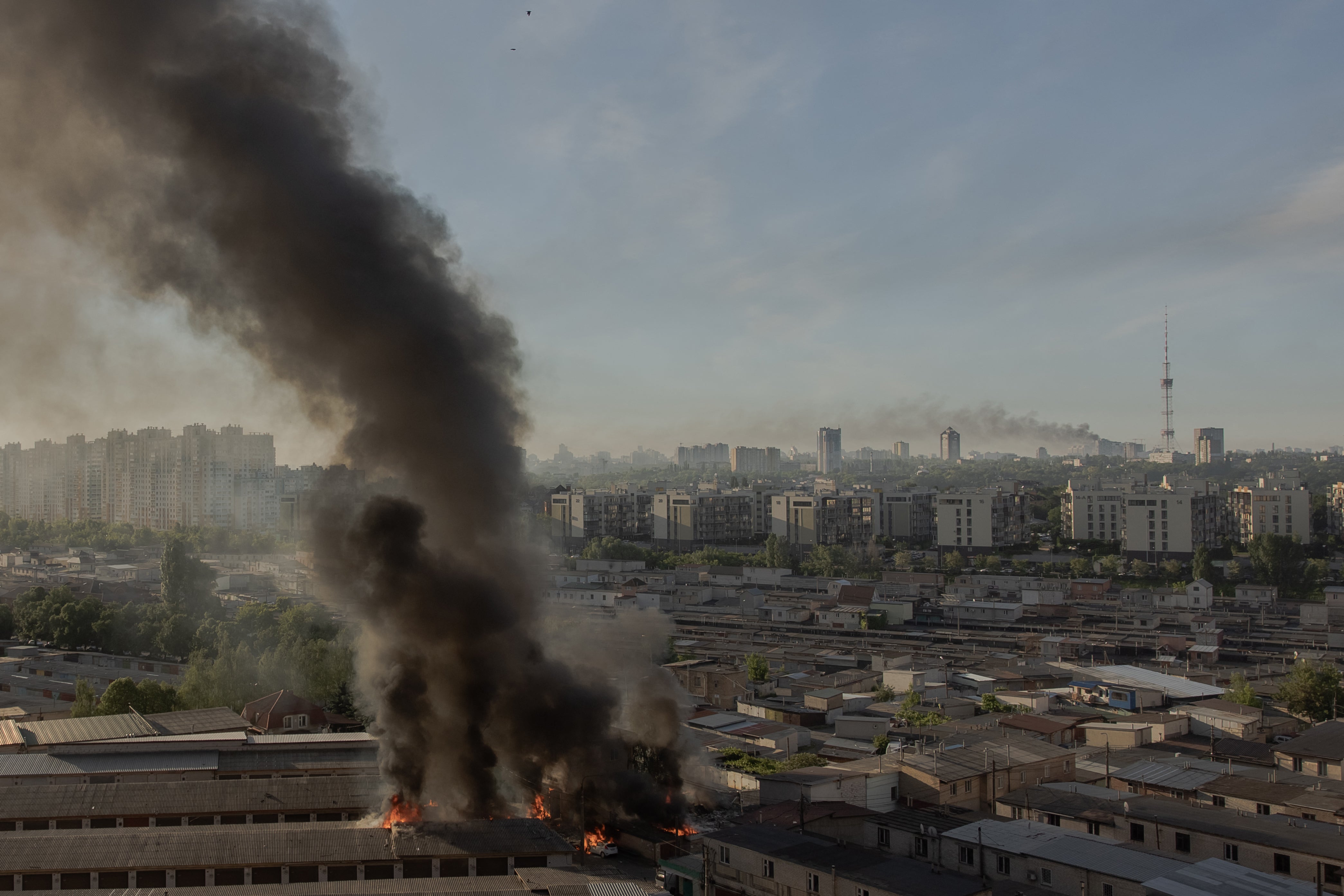 Smoke rises from different places damaged during a Russian missile and drone strikes in Kyiv (AFP/Getty)