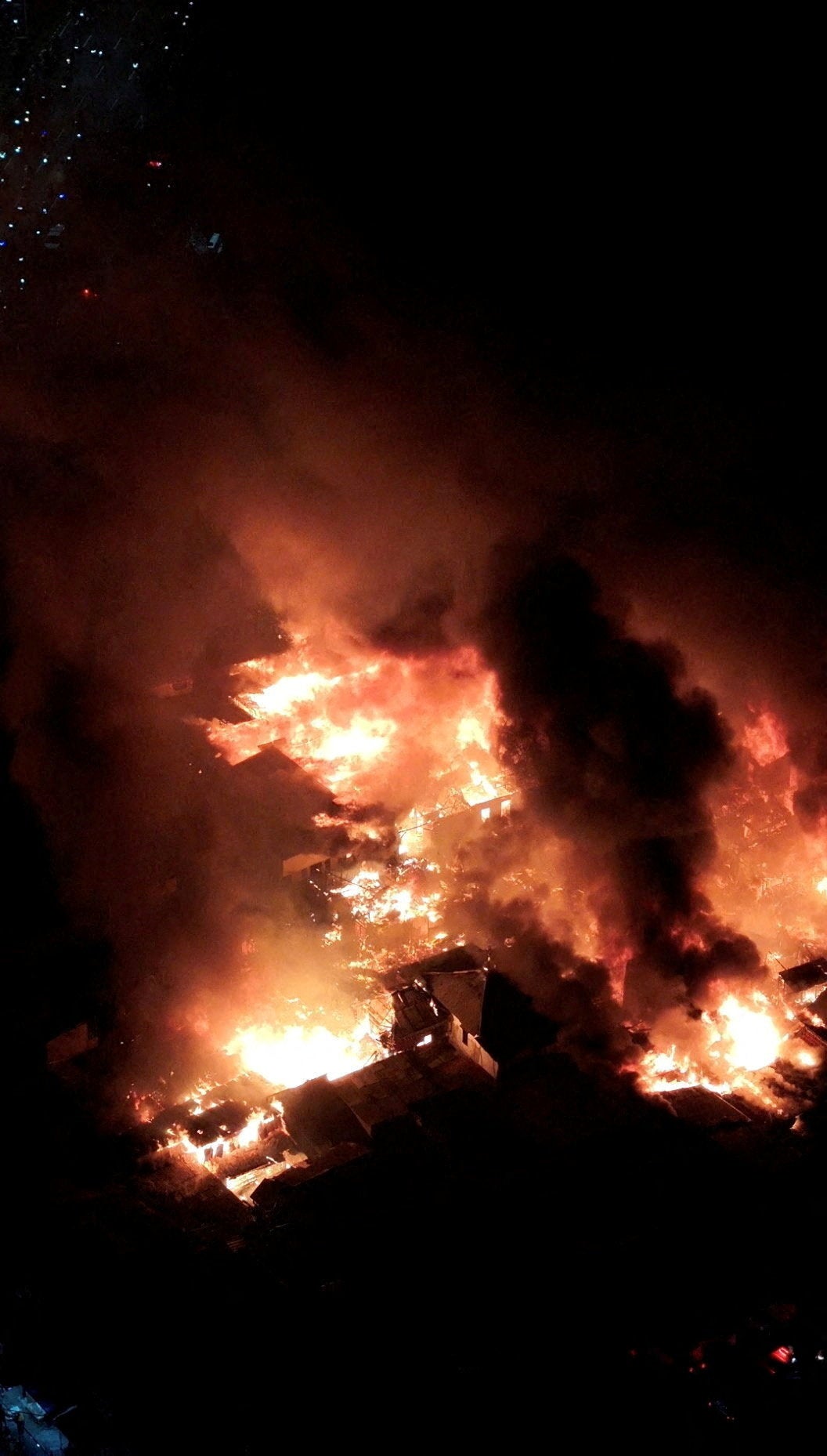 A drone view shows smoke and fire rising from Jiung market in Jakarta, Indonesia (Reuters)