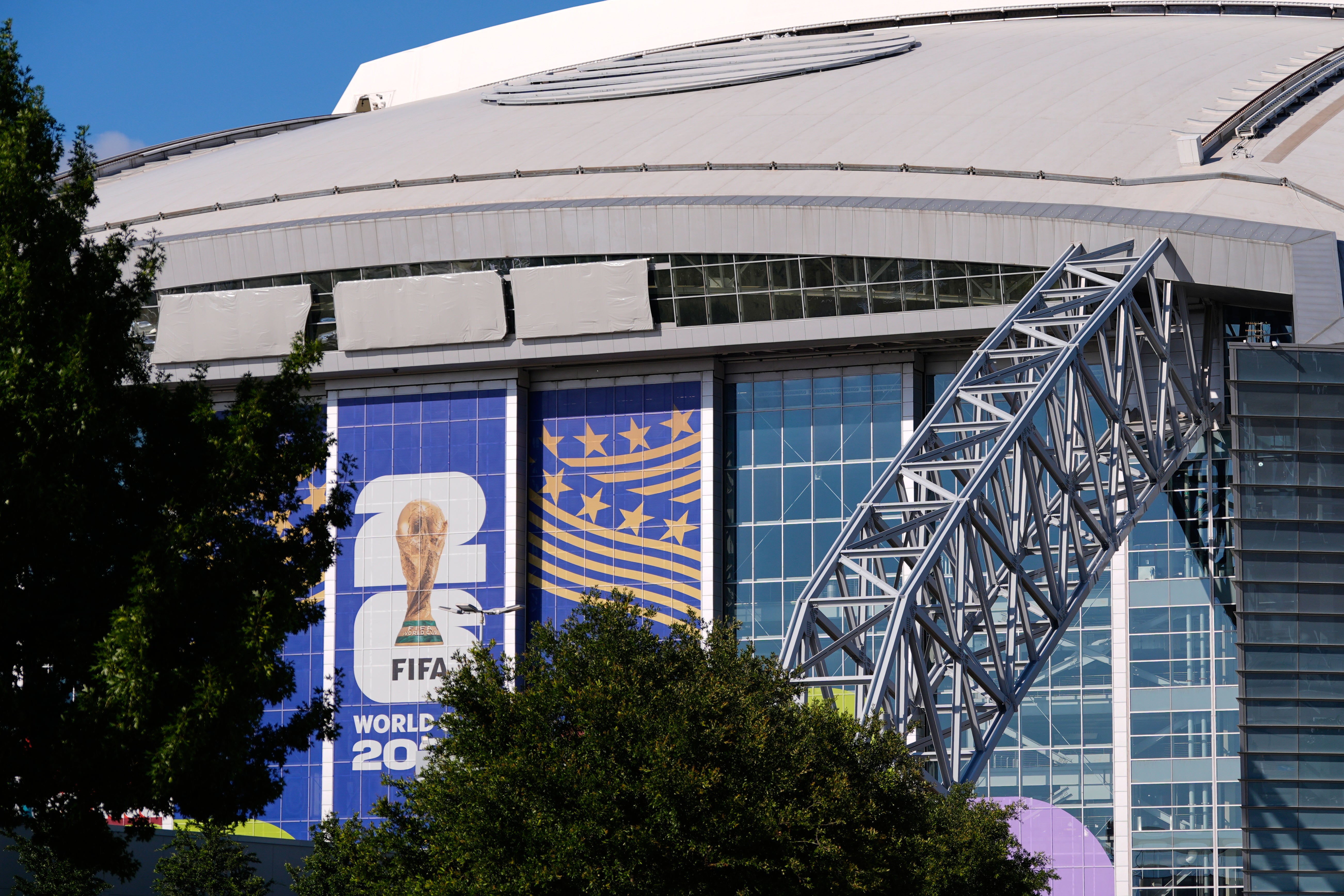 AT&T Stadium, where upcoming World Cup soccer matches are scheduled to be played, has its name covered by three grey tarps on Monday, 1 June 2026