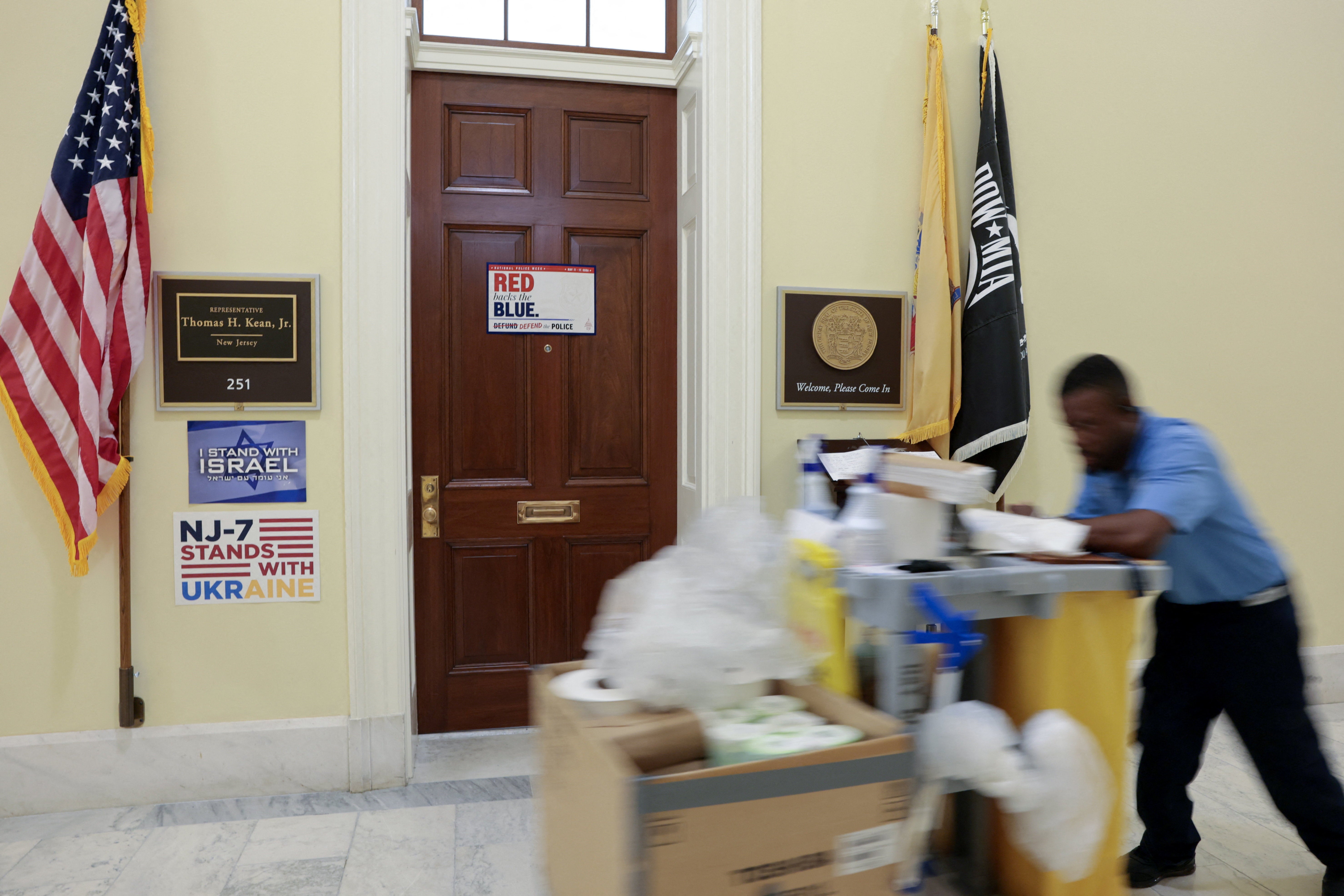 A worker passes the office door of U.S. Representative Tom Kean Jr. (R-NJ), who has not been seen in public in two months, at the Cannon House Office Building on Capitol Hill