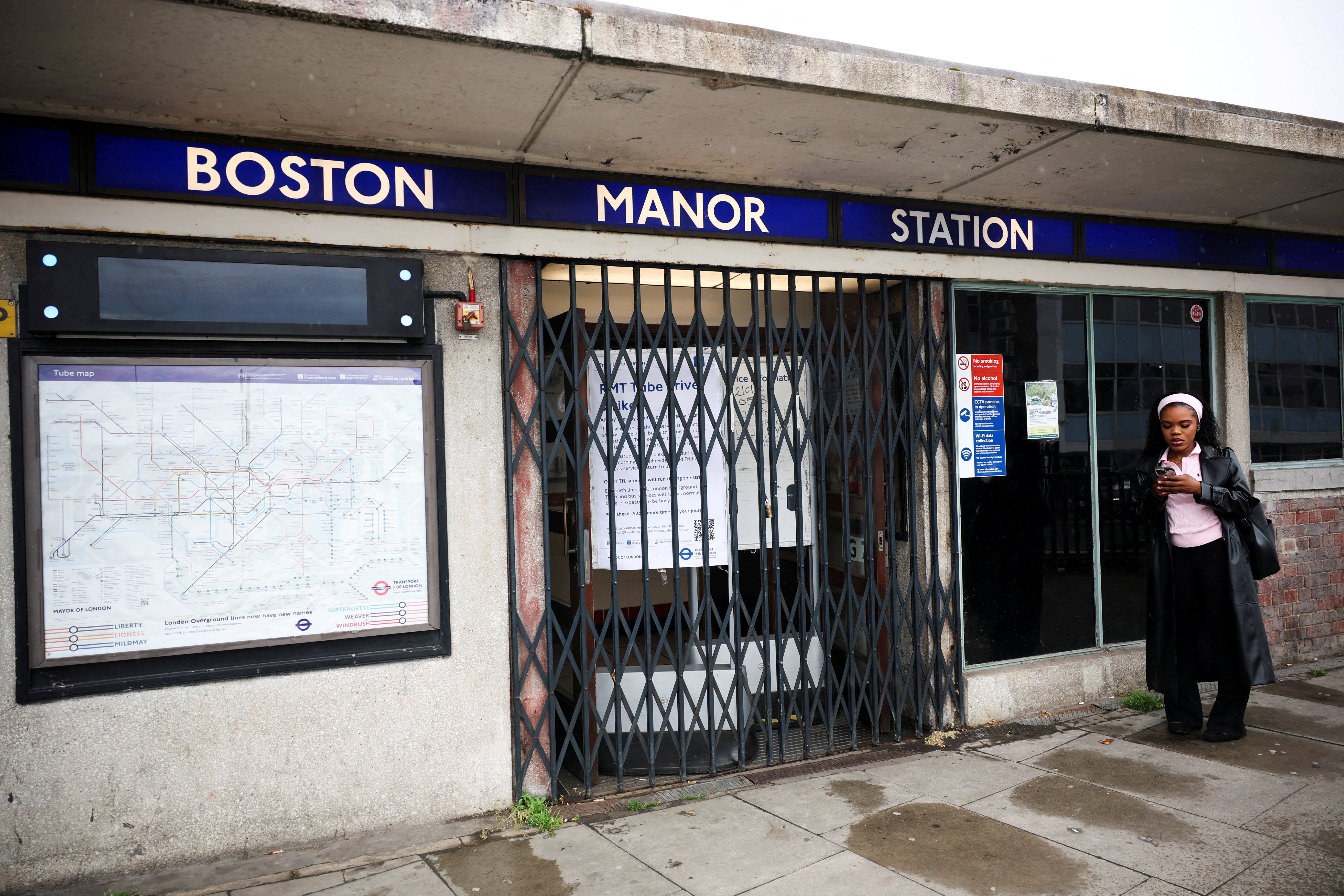 Boston Manor station has its barriers down as the Piccadilly line is part suspended