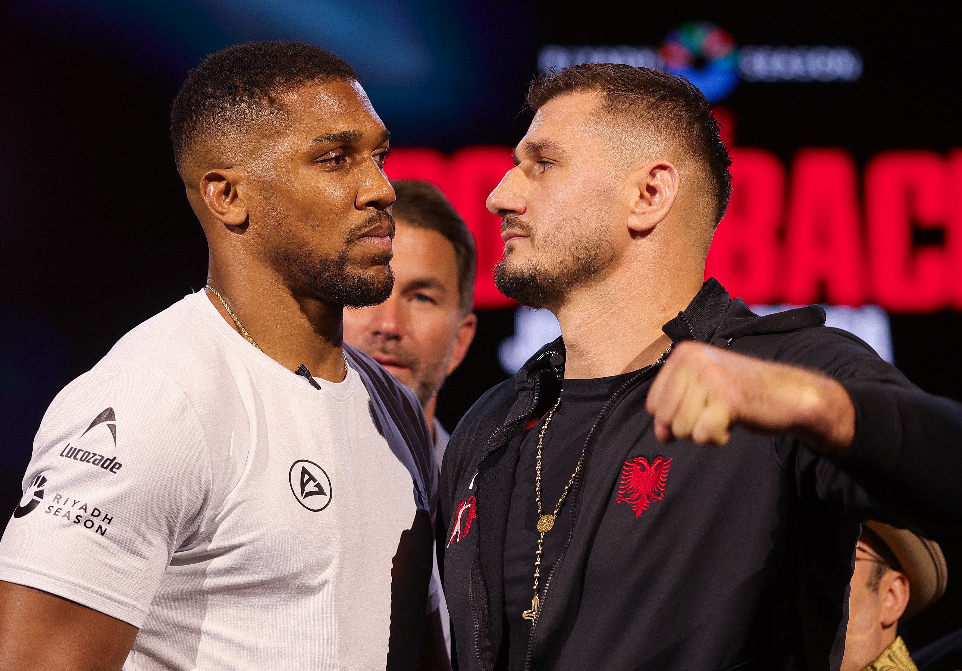 Joshua facing off with his July opponent Kristian Prenga