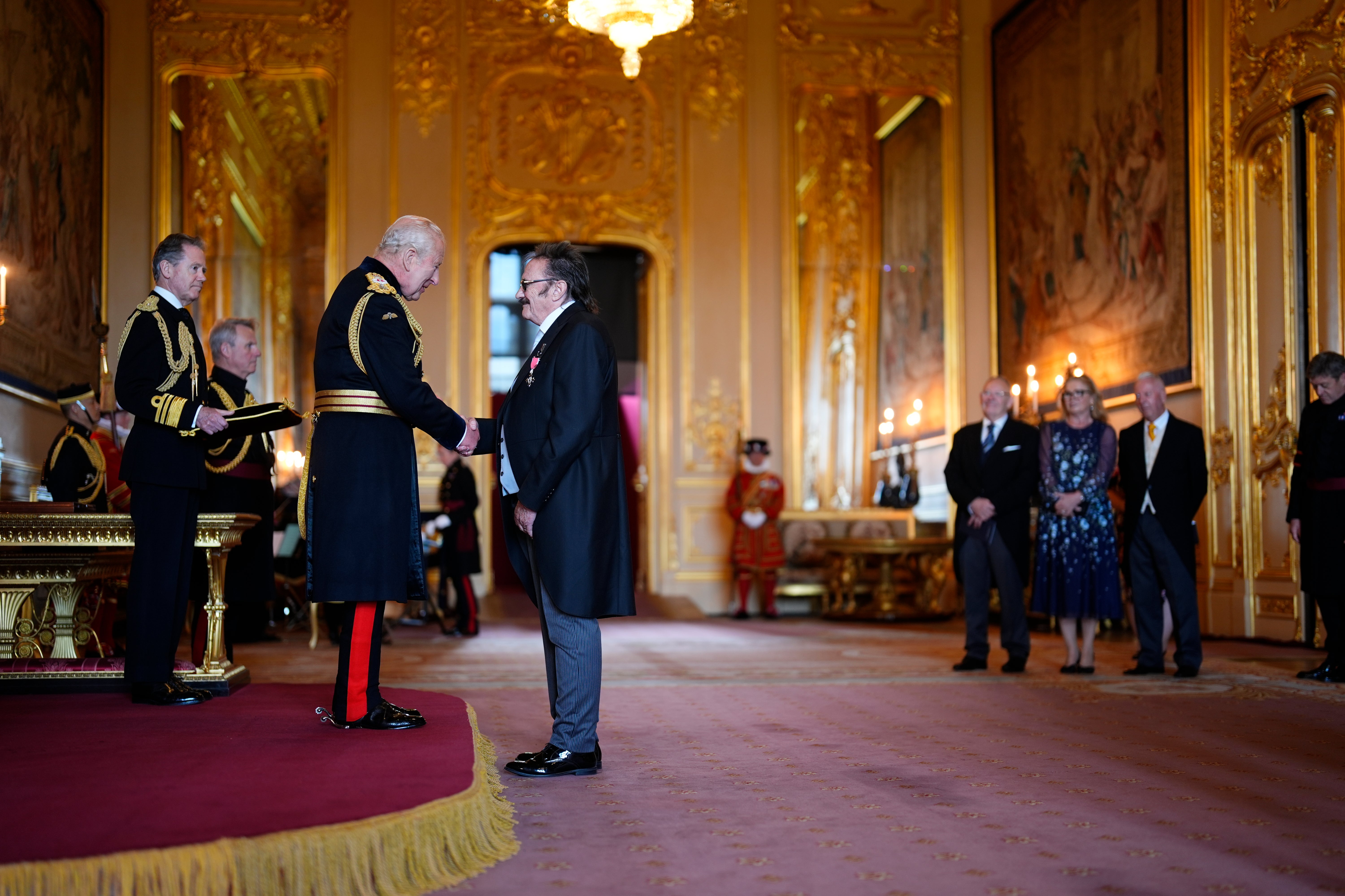 Paul Elliott, from Retford, Ambassador, Marie Curie, is made a Member of the Order of the British Empire by King Charles III at Windsor Castle (PA)