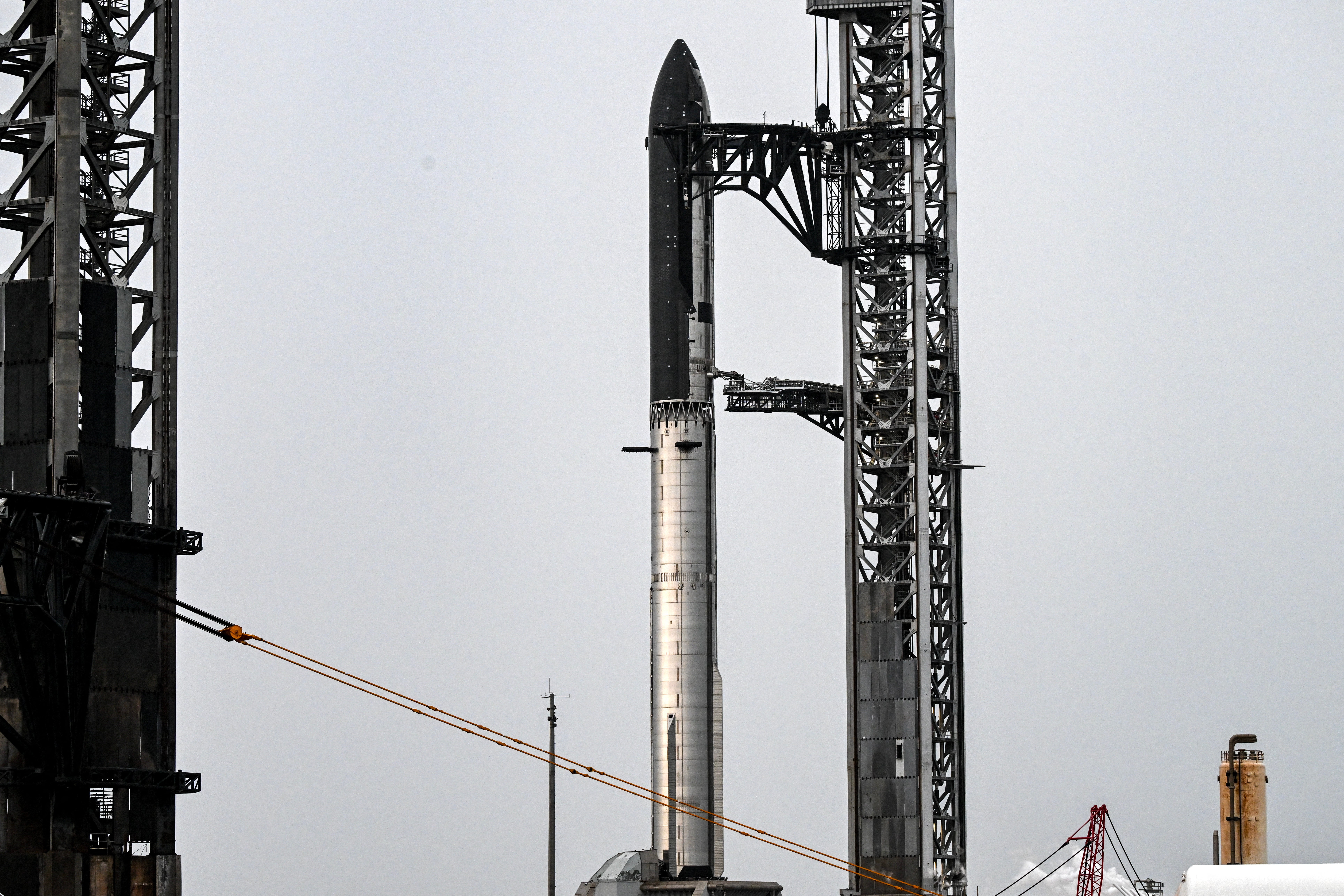 SpaceX's new Starship V3 rocket is seen docked at the Starbase during the 12th test flight on May 21, 2026 as seen from South Padre Island in Texas
