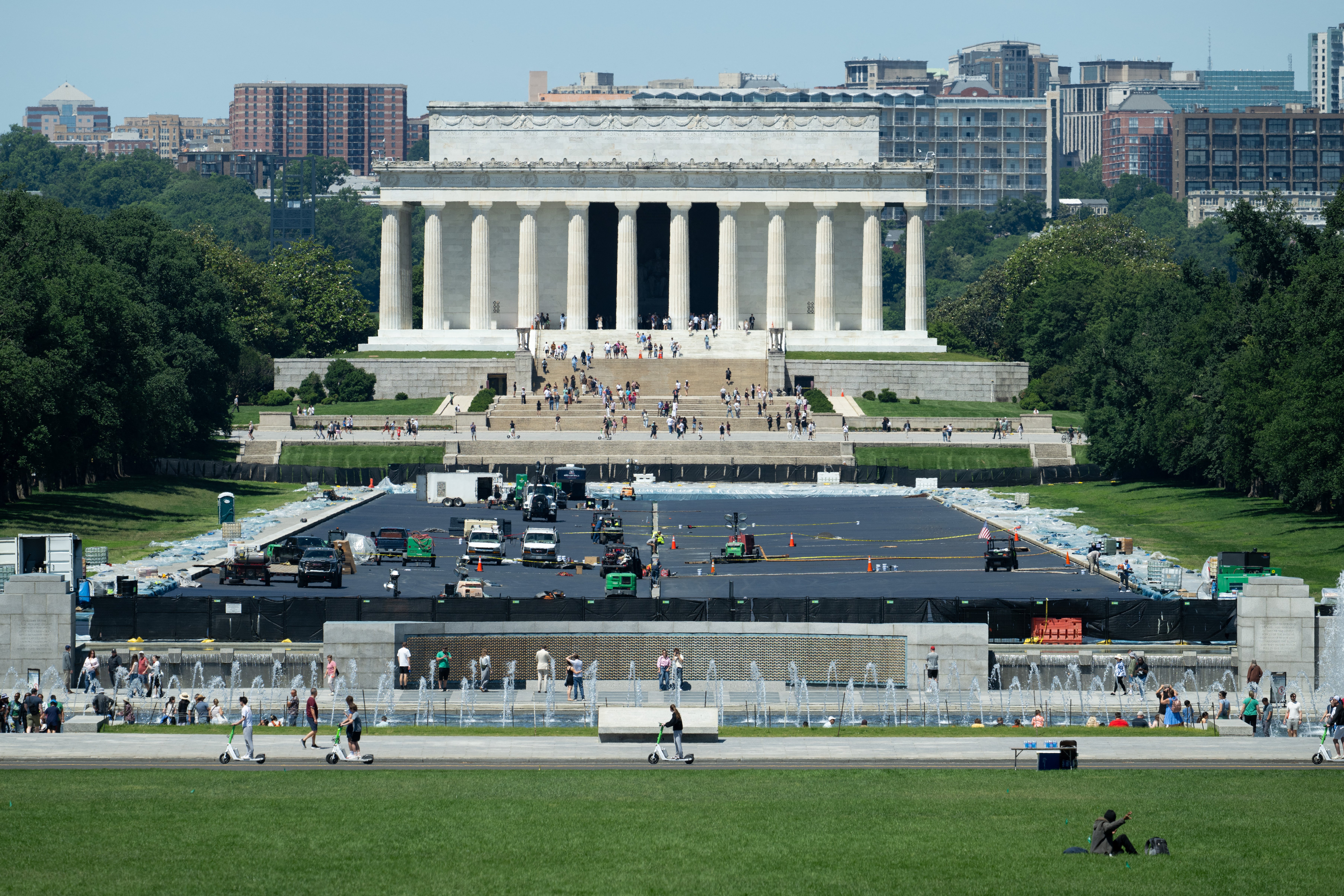 Work continues to resurface the bottom of the Reflecting Pool on the National Mall near the Lincoln Memorial in Washington, DC