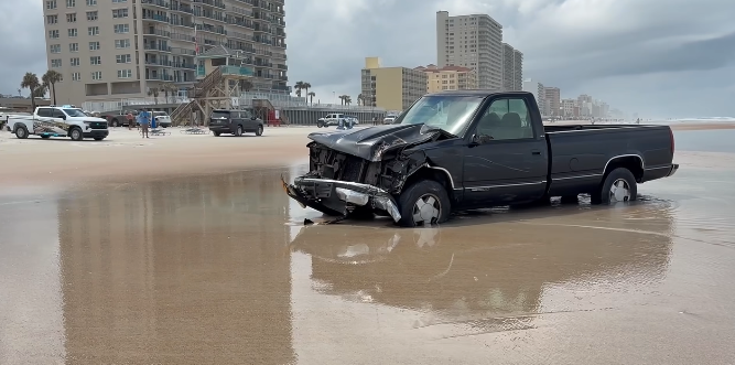 A Florida toll booth attendant was killed Monday when a car crashed into her station before driving onto the beach, authorities said