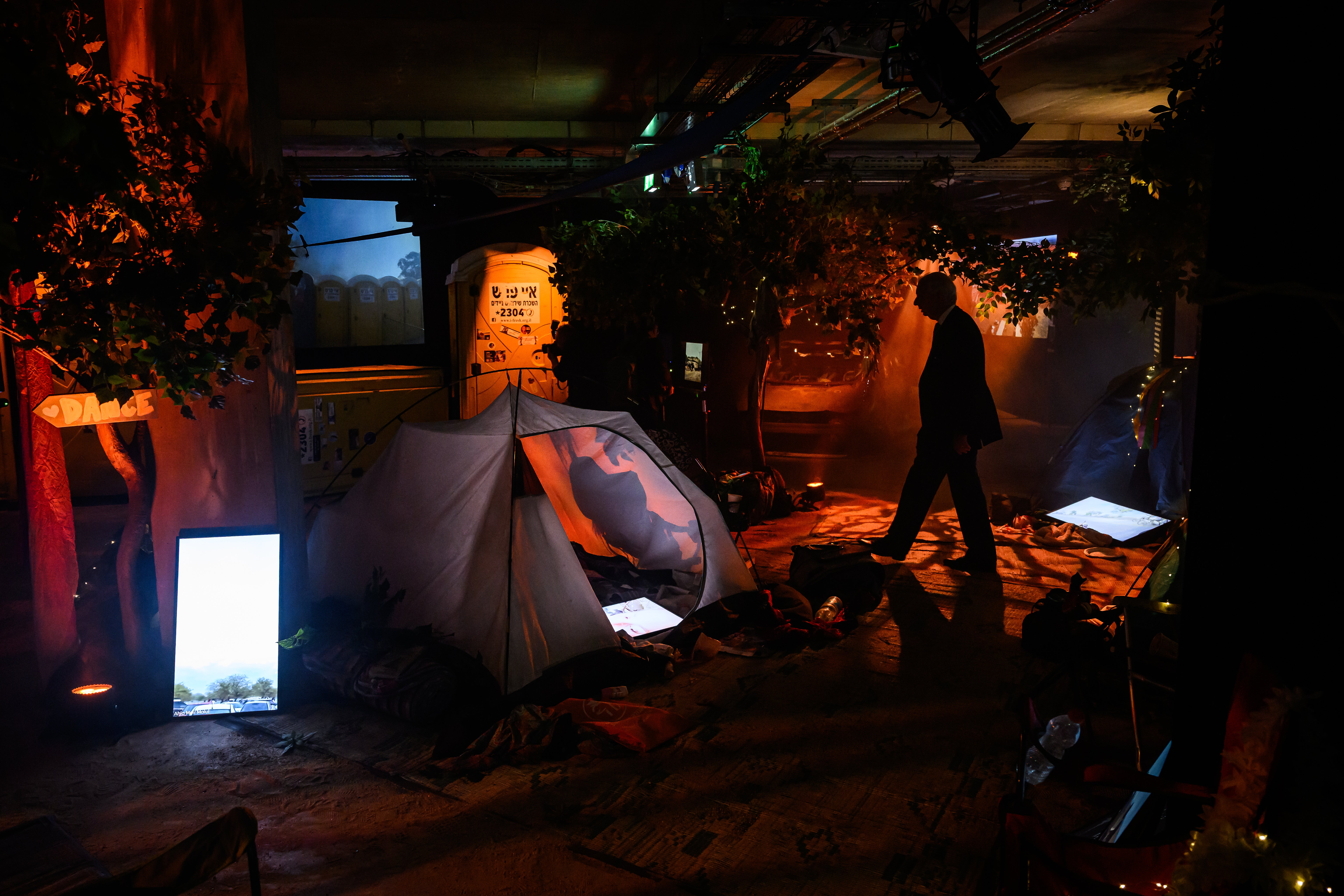 The installation provides a timeline of the horrific events that unfolded that day, amid actual staging, vehicles, and discarded personal items from the festival site