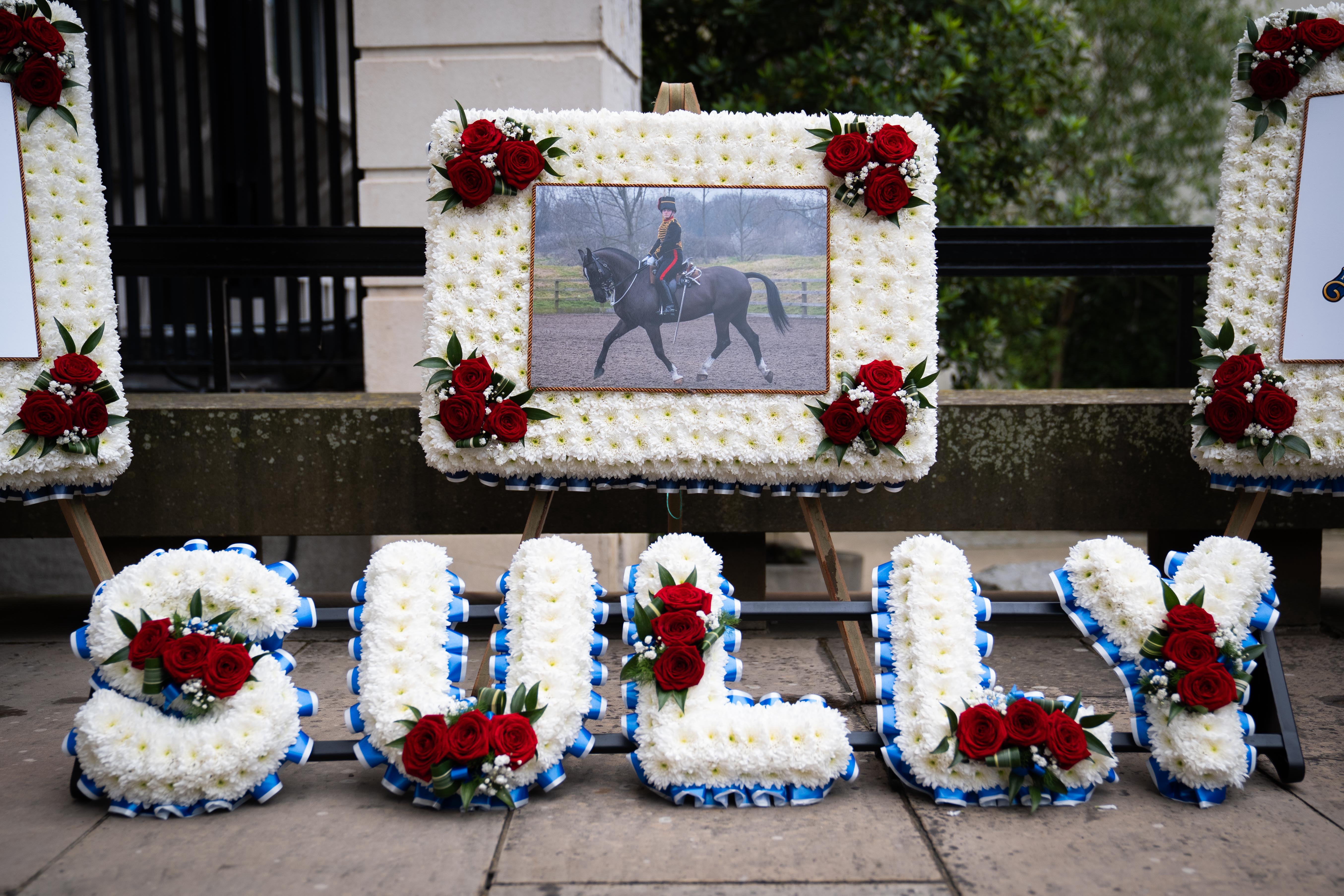 Floral tributes spelled out ‘Sully’, the name L/Bdr Sullivan was called by friends (PA Wire)