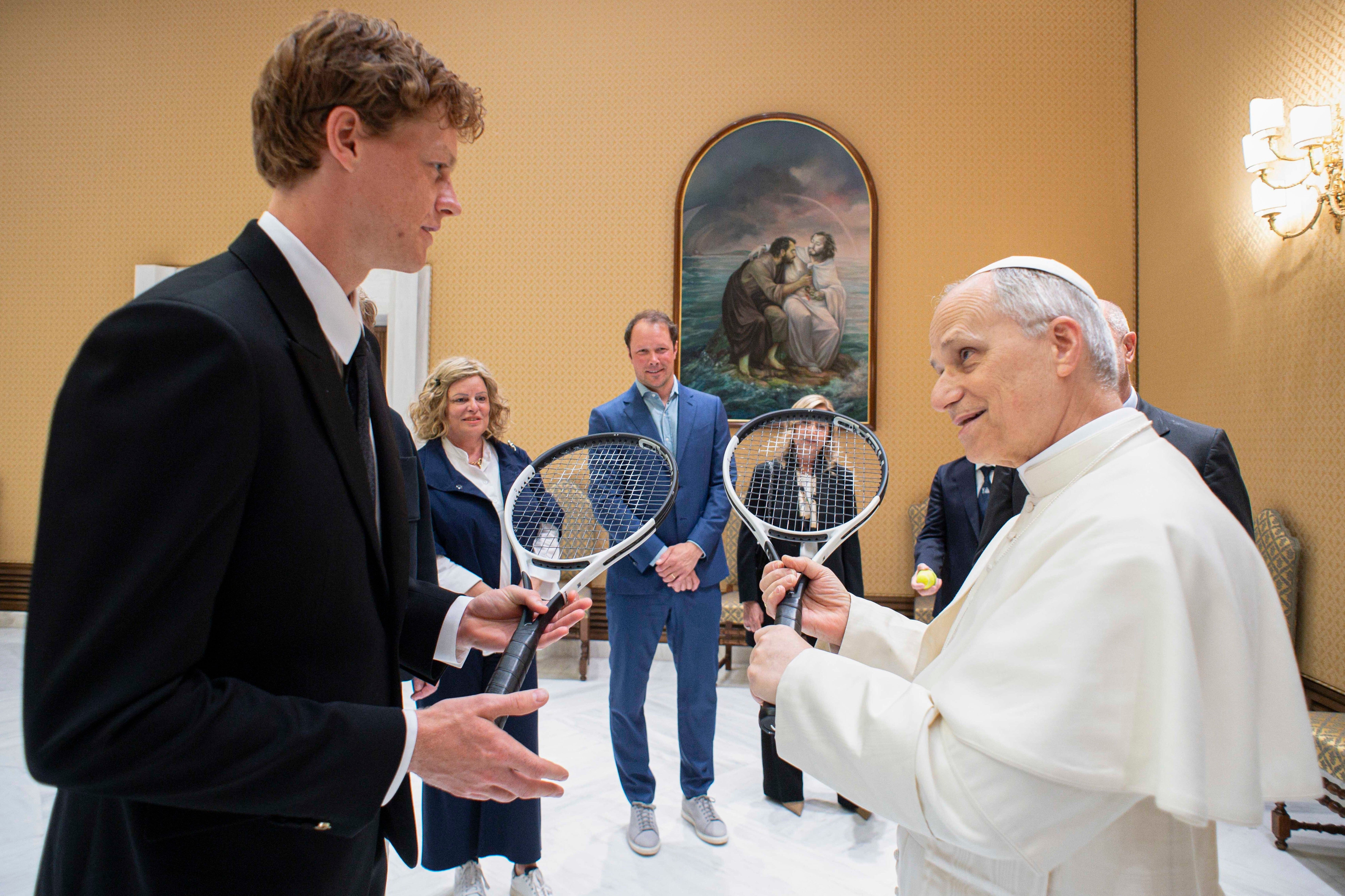Italy's Jannik Sinner, left, shares a light moment with Pope Leo XIV on the occasion of their meeting at the Vatican, May 14, 2025