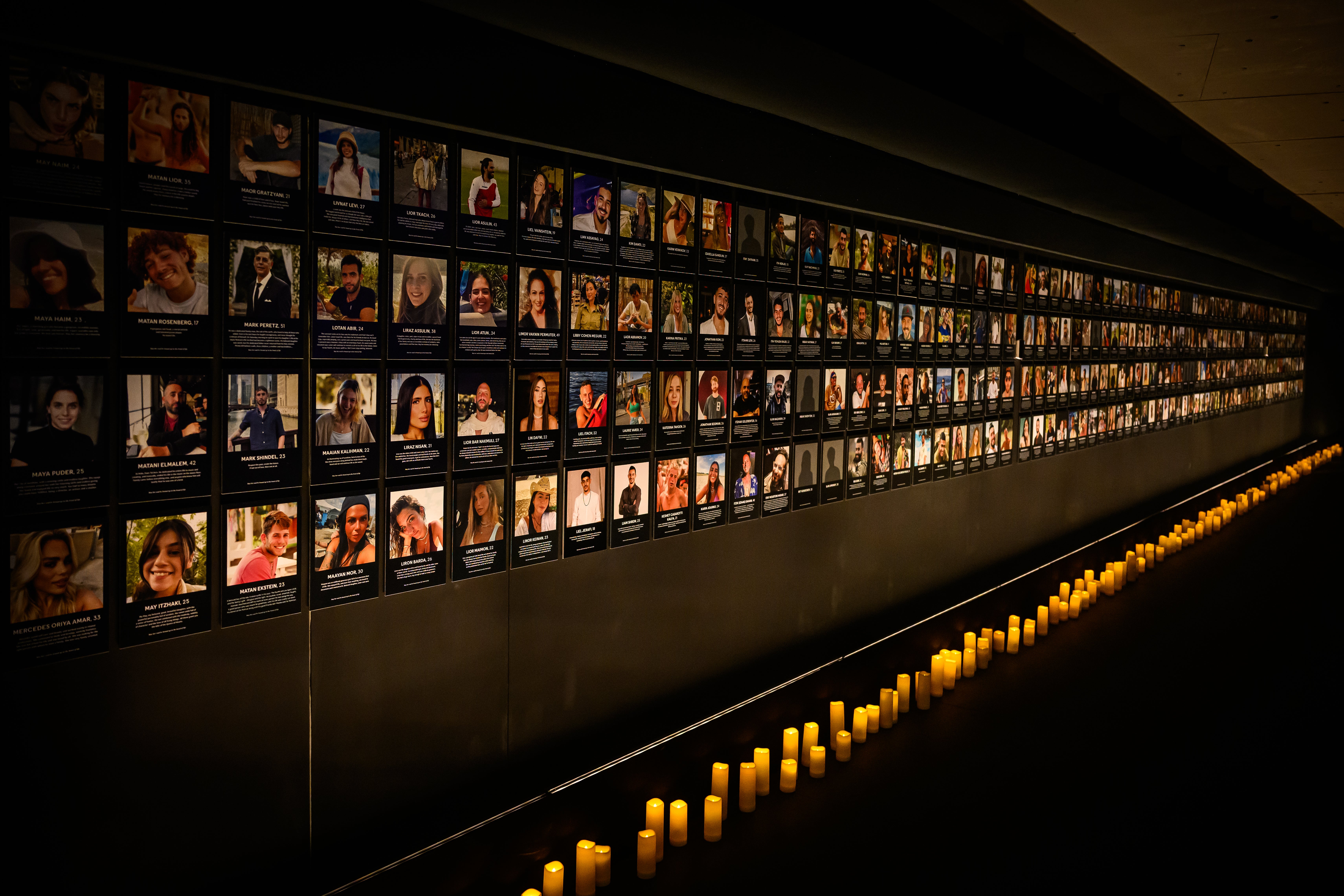 A gallery of images showing those killed in the attack is displayed at the Nova Exhibition