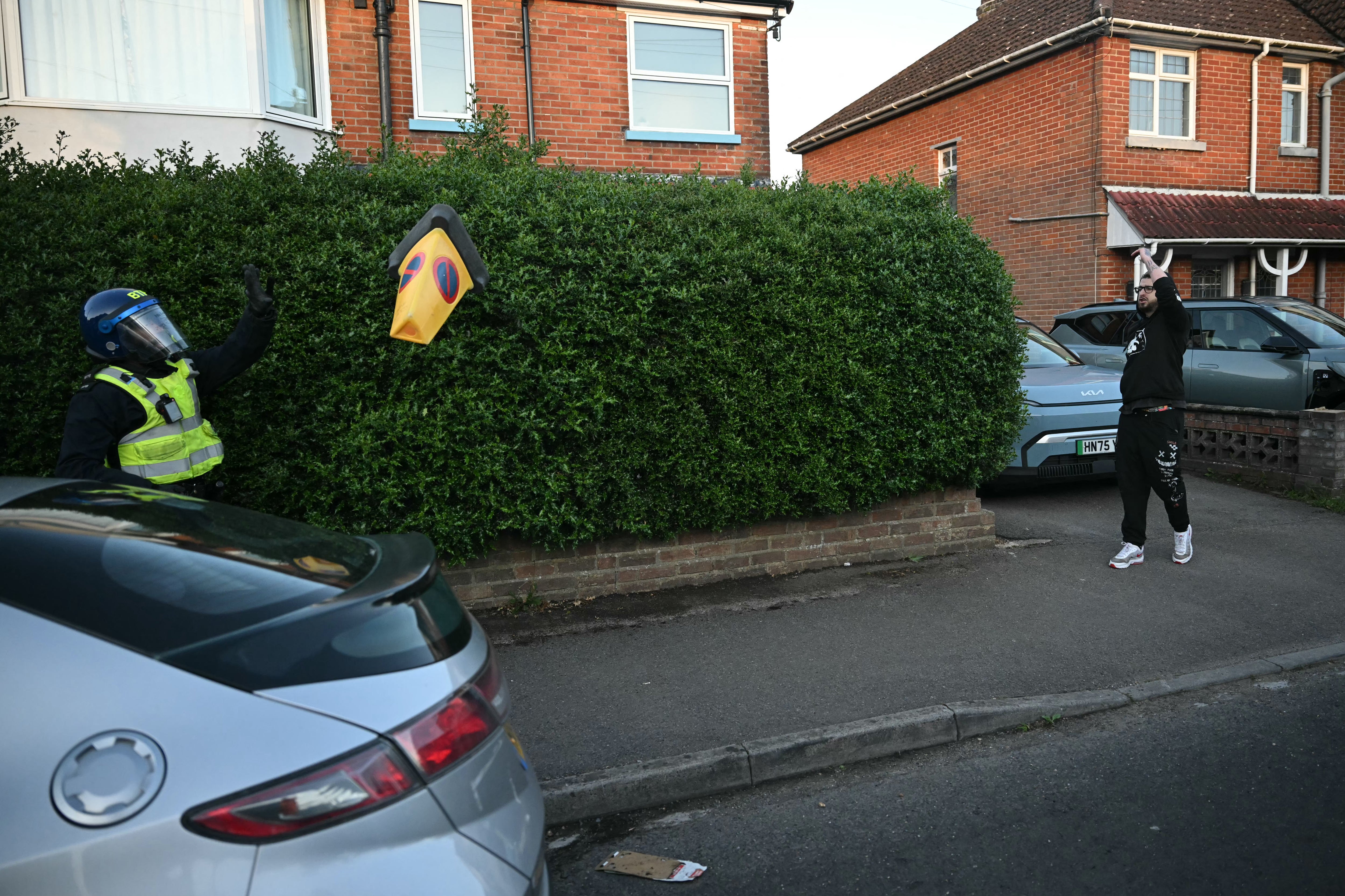 Demonstrators throw items at police officers near Portswood Police Station