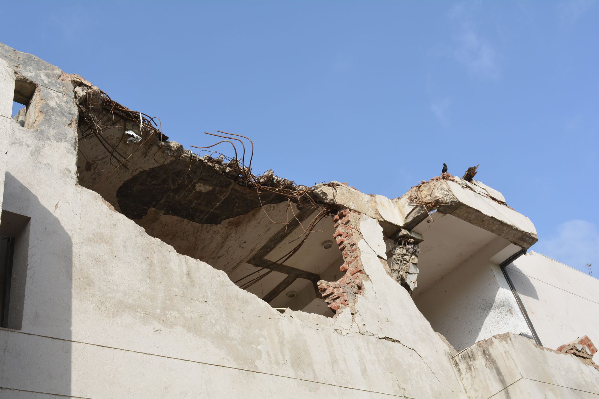 The tail of the crashed Air India plane is lodged in a hostel building of BJ Medical College in Ahmedabad on 12 June 2025