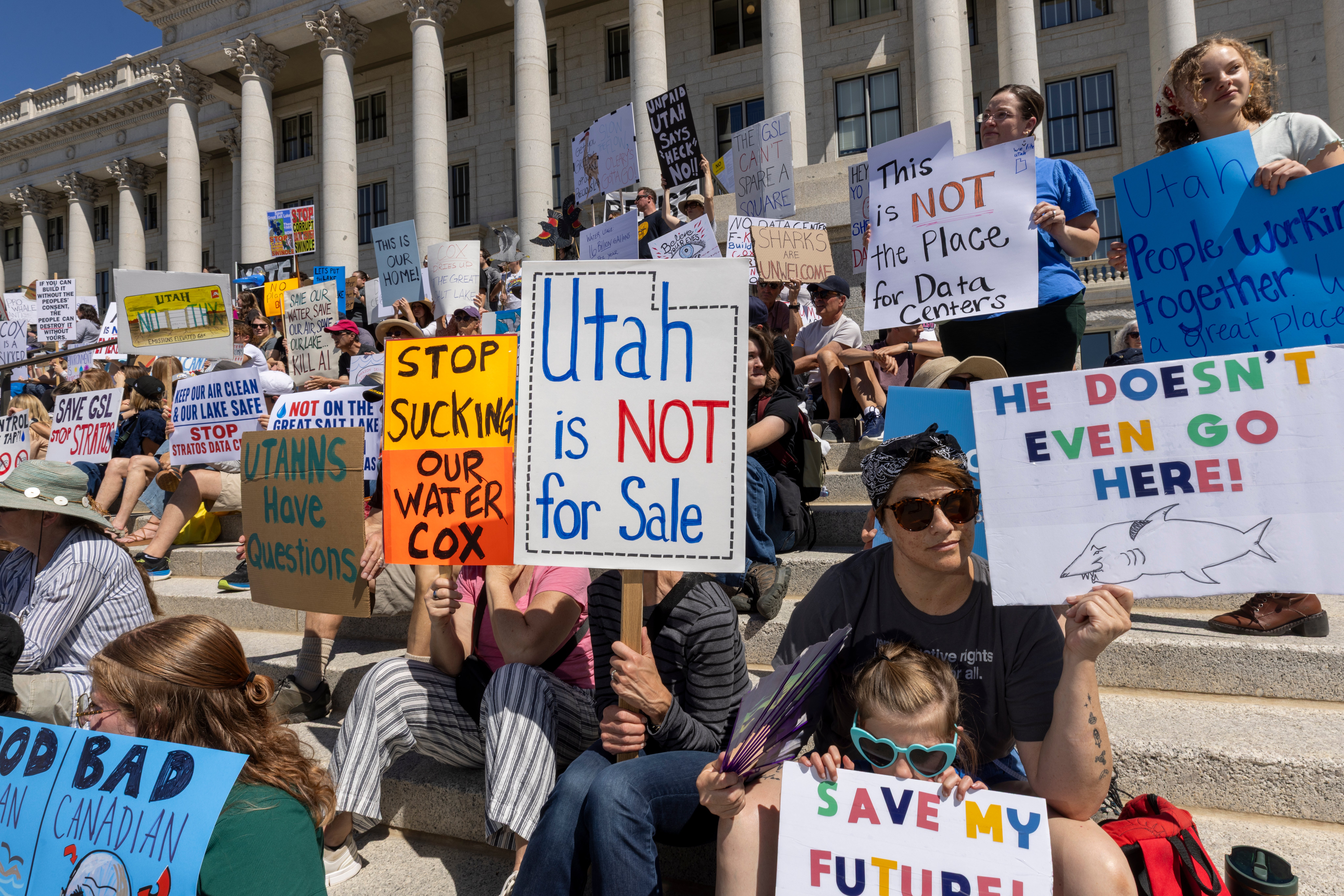 Protesters gather outside the Utah state capitol building to oppose the construction of a data center near the Great Salt Lake (Getty)