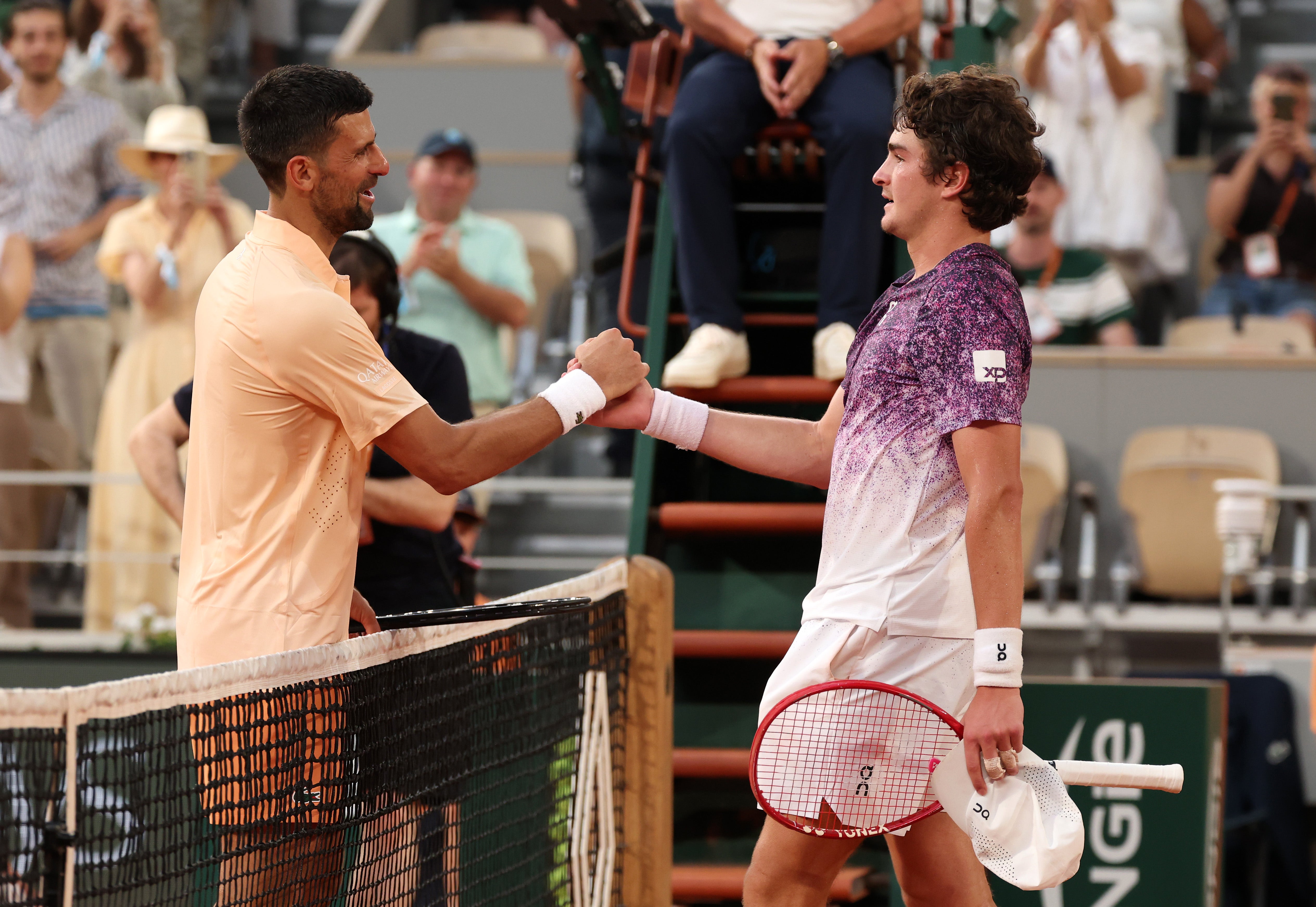 Fonseca (right) defeated Novak Djokovic at the 2026 French Open