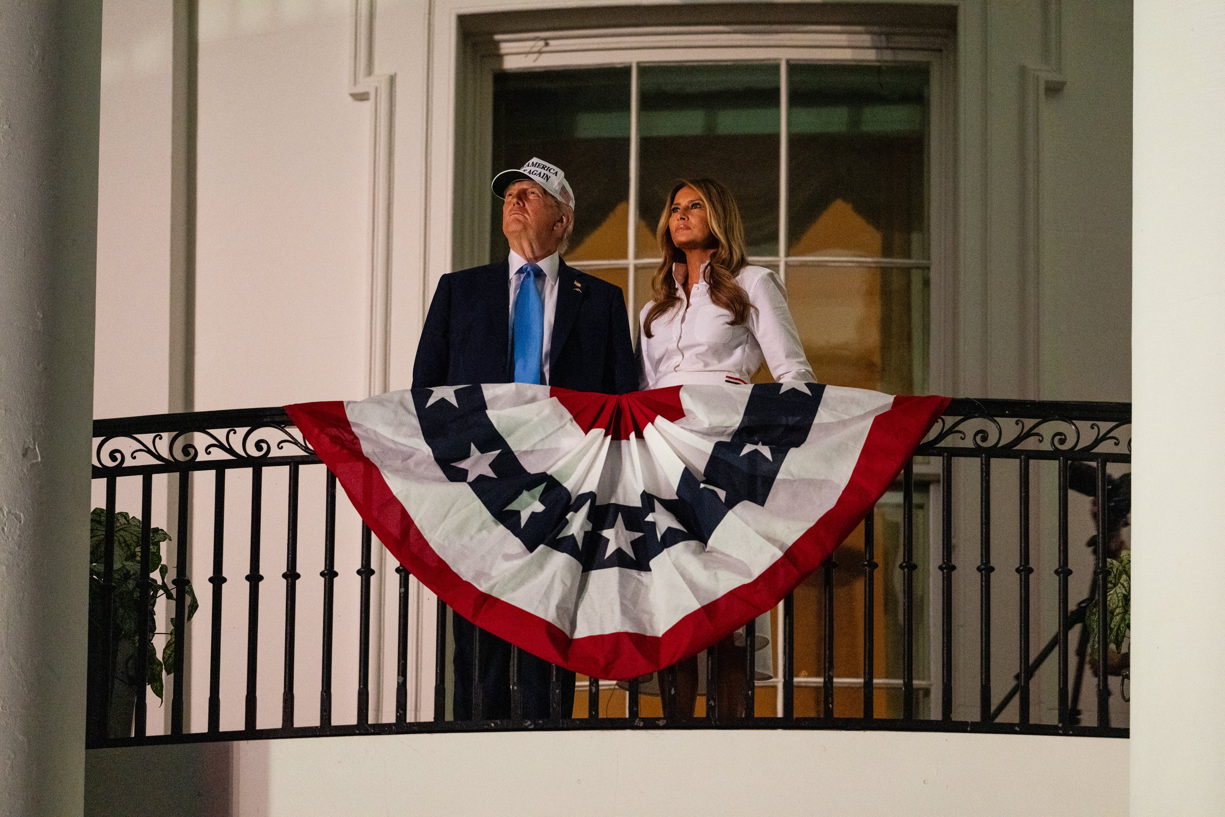 President Donald Trump, seen here watching fireworks with first Lady Melania Trump from the White House in 2025 is reportedly using $90 million in fees for national parks passes to pay for this year&rsquo;s $1.6 million pyrotechnics show
