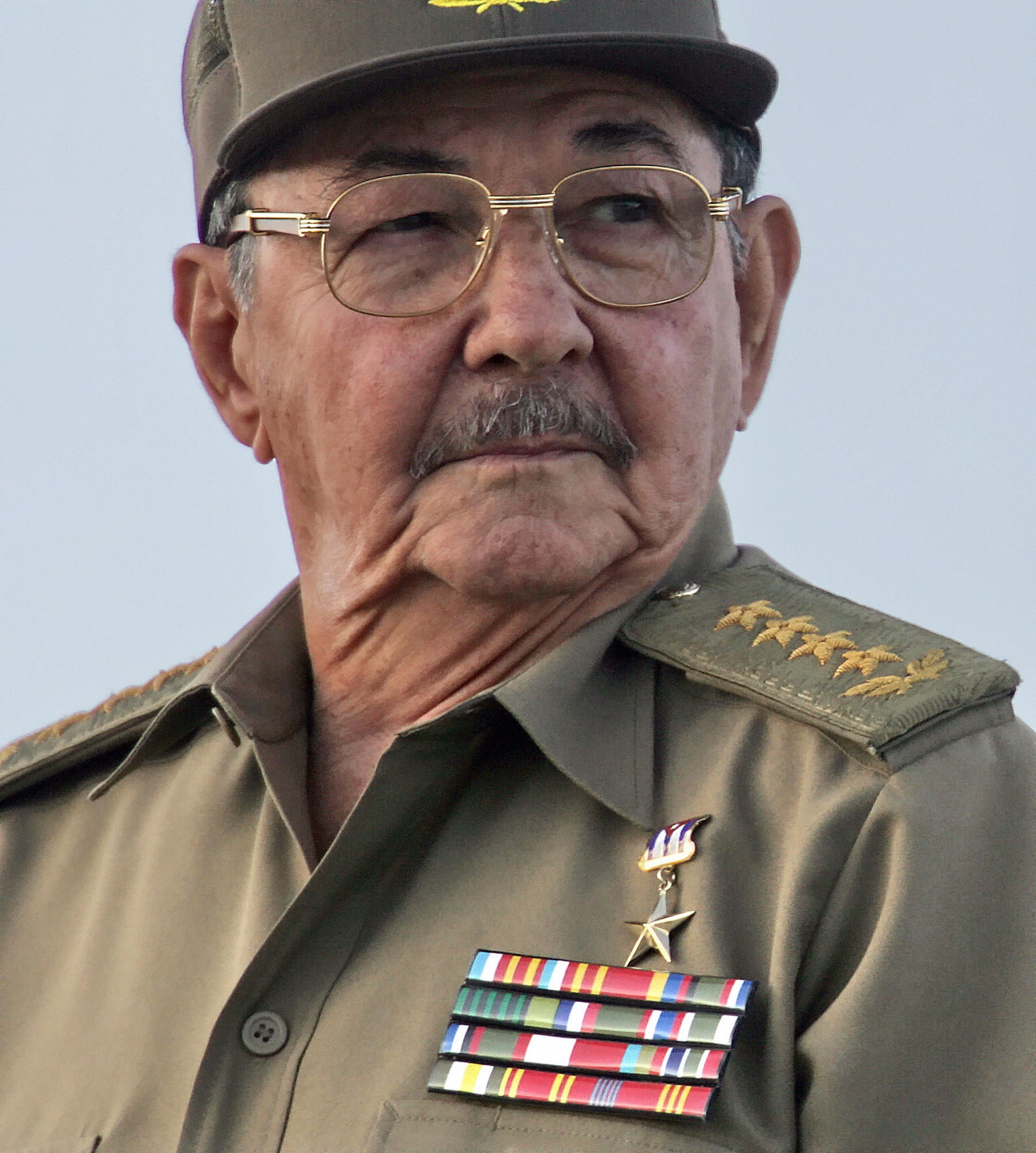 Then-acting President Raul Castro participates in a military parade in December 2006