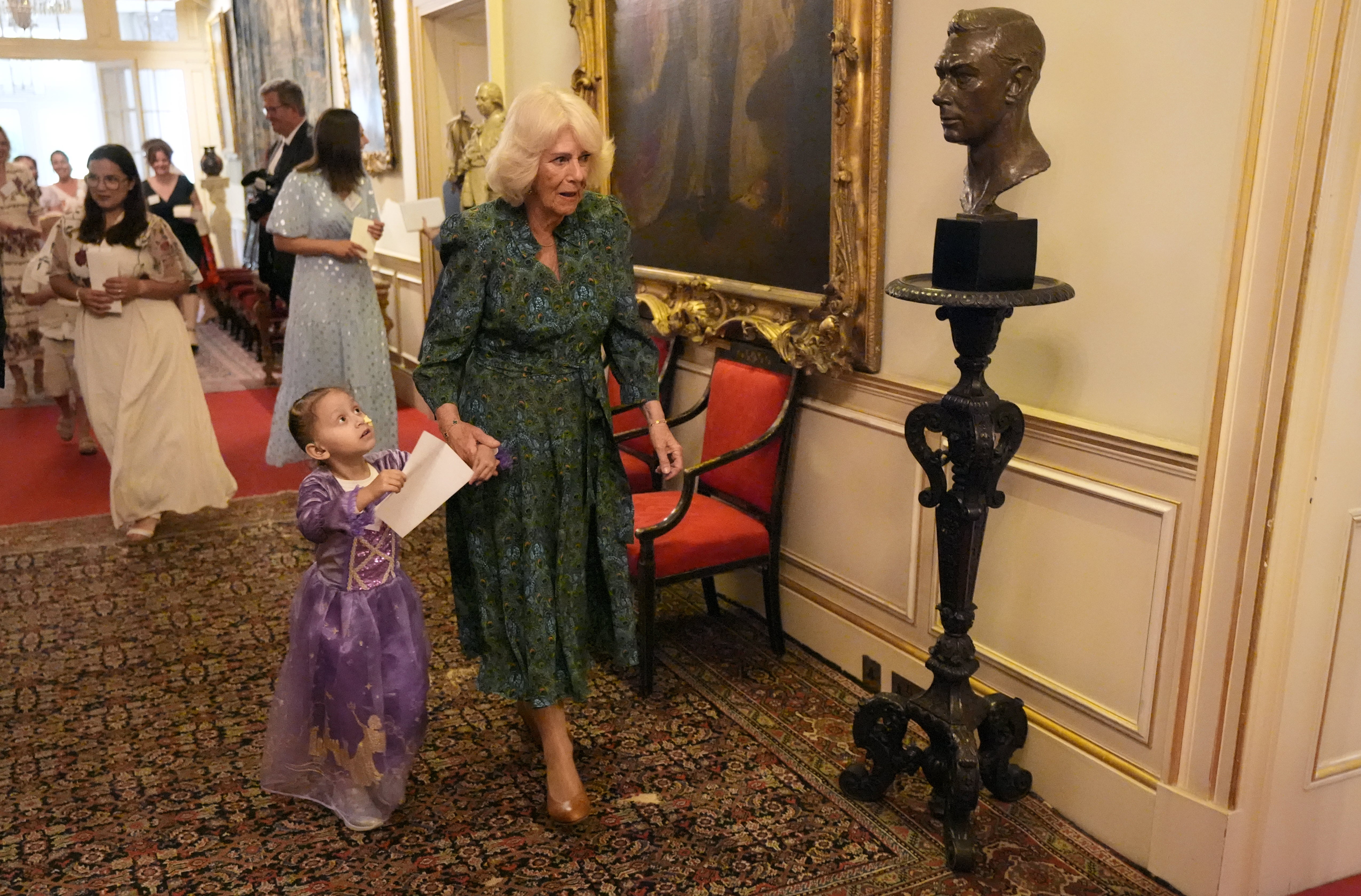 Camilla helps children in a treasure hunt as she hosts a tea party at Clarence House (Andrew Matthews/PA) (PA Wire)