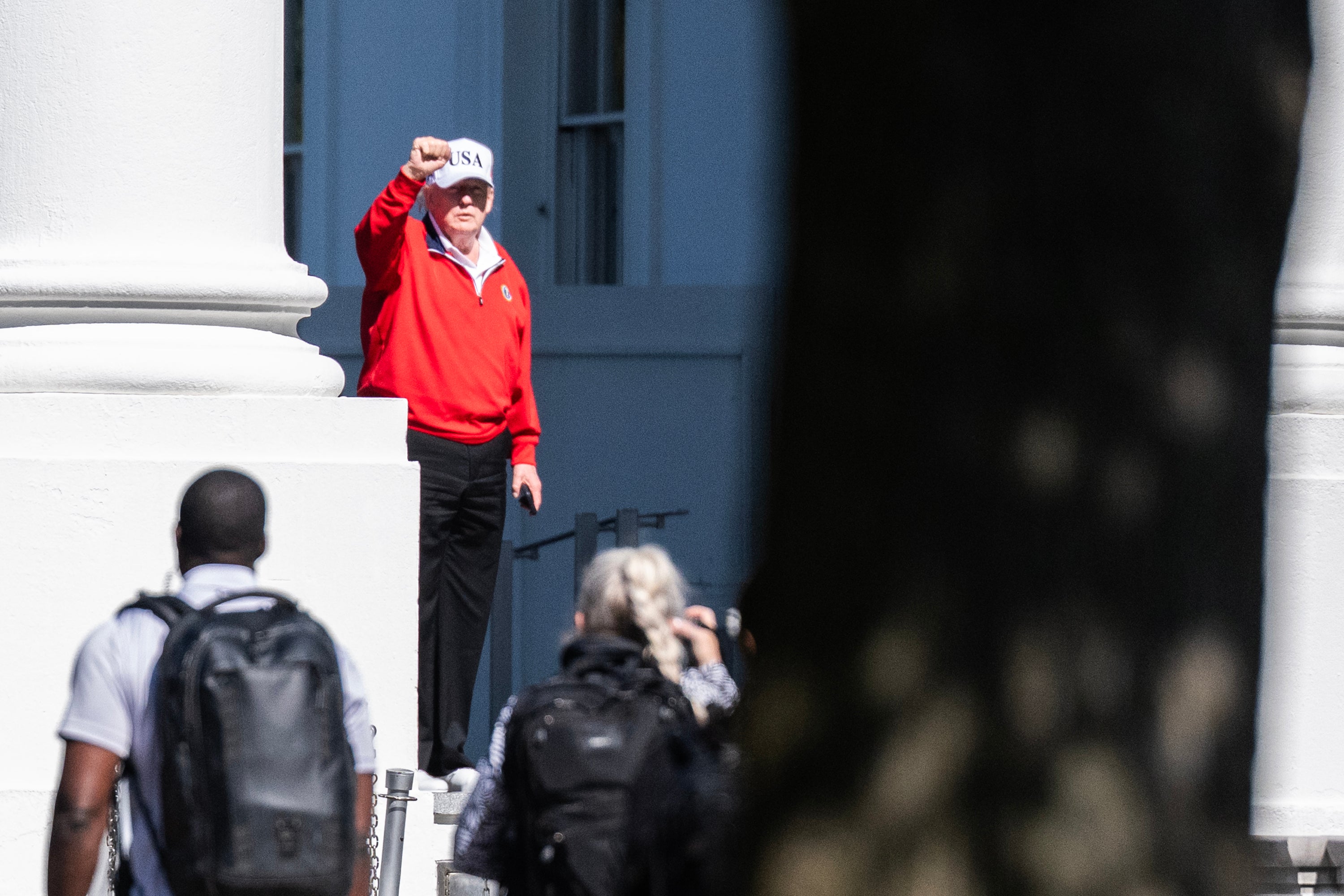 President Donald Trump waves as he returns to the White House after spending the day at Trump National Golf Club in Sterling, Virginia last weekend, after the White House released a report that said his third physical in 11 months showed he is in 