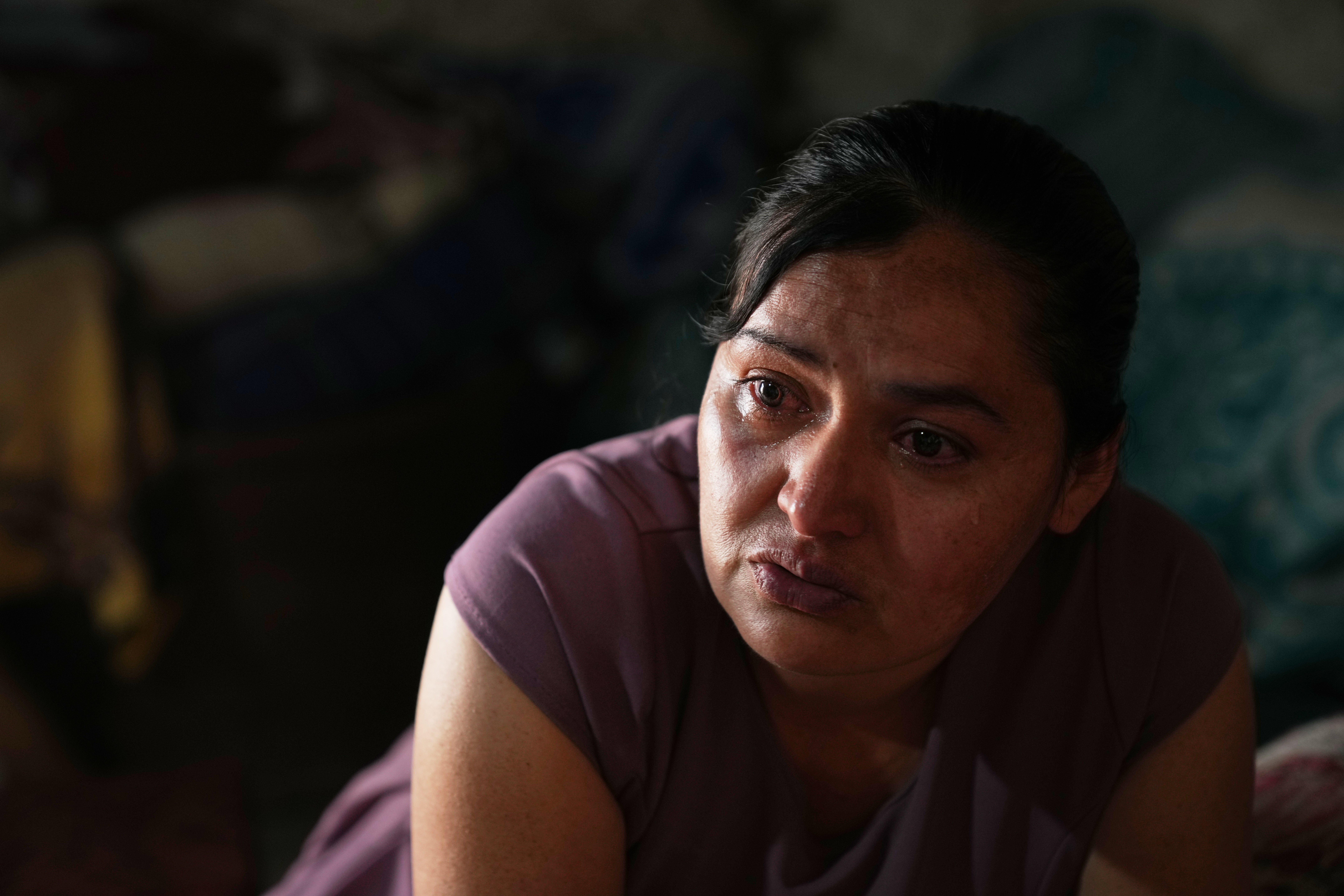 Mirsy Maricela Alva Lopez, a Guatemalan migrant who has been separated from her son Ederson twice, cries during an interview at her parents' house in San Martín Cuchumatán, Guatemala