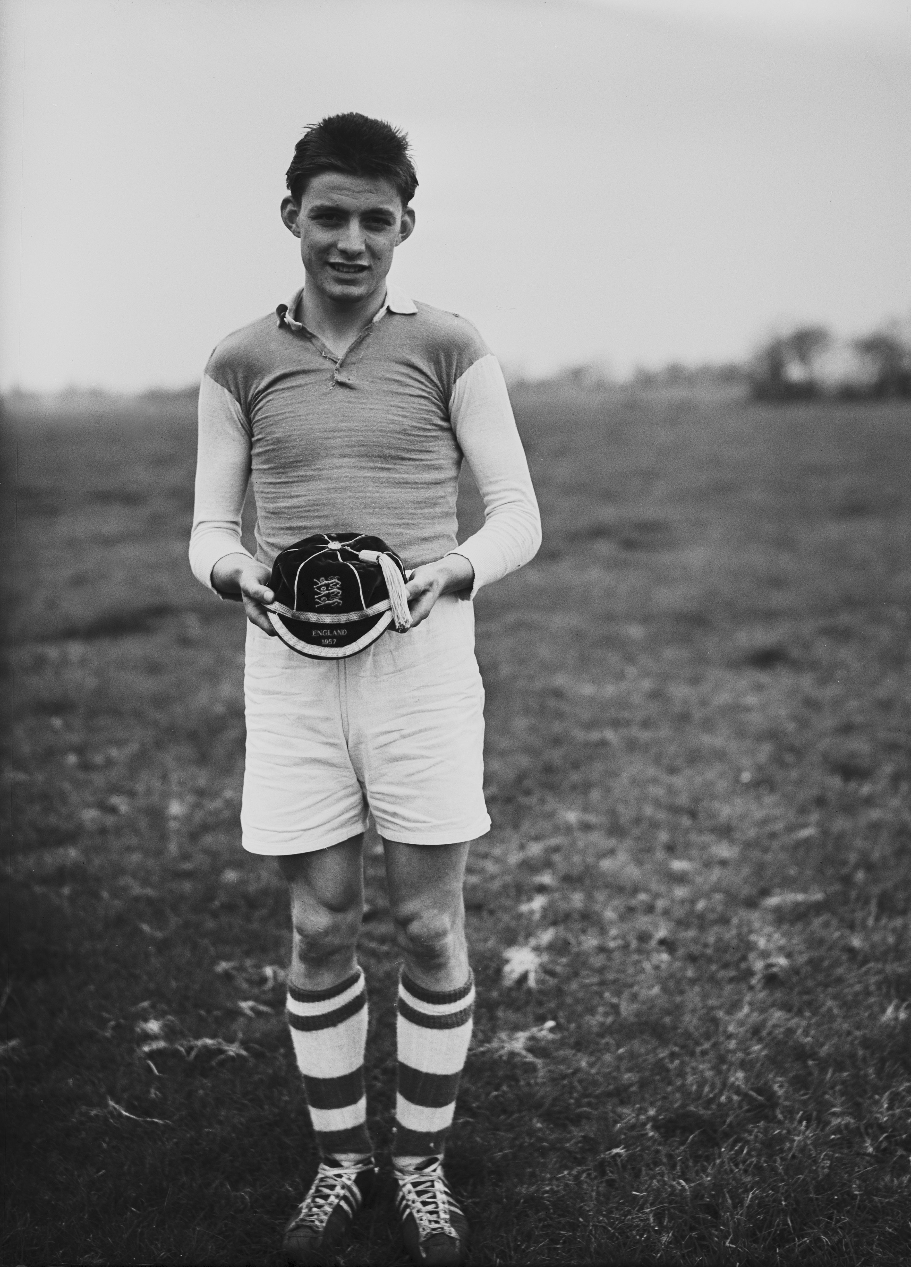 English footballer Bobby Tambling, aged 15, holding his England schoolboys international cap, April 3rd 1957. (Photo by Evening Standard/Hulton Archive/Getty Images)