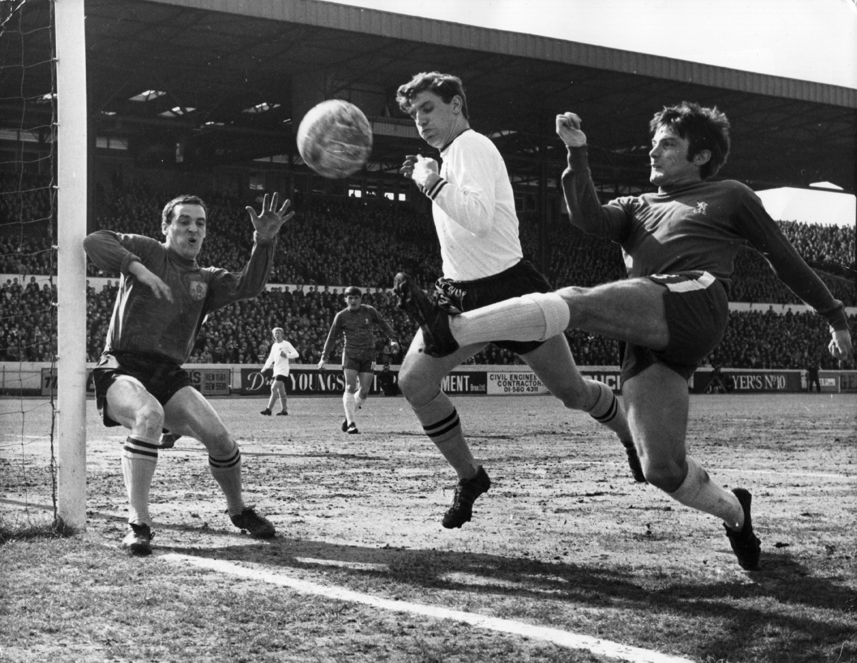 5th April 1969: Bobby Tambling (right) of Chelsea tries a shot at goal from an acute angle, as Latcham of Burnley attempts to block him and goalkeeper, Thomson, covers his near post, during a match at Stamford Bridge. (Photo by Douglas Miller/Keystone/Getty Images)
