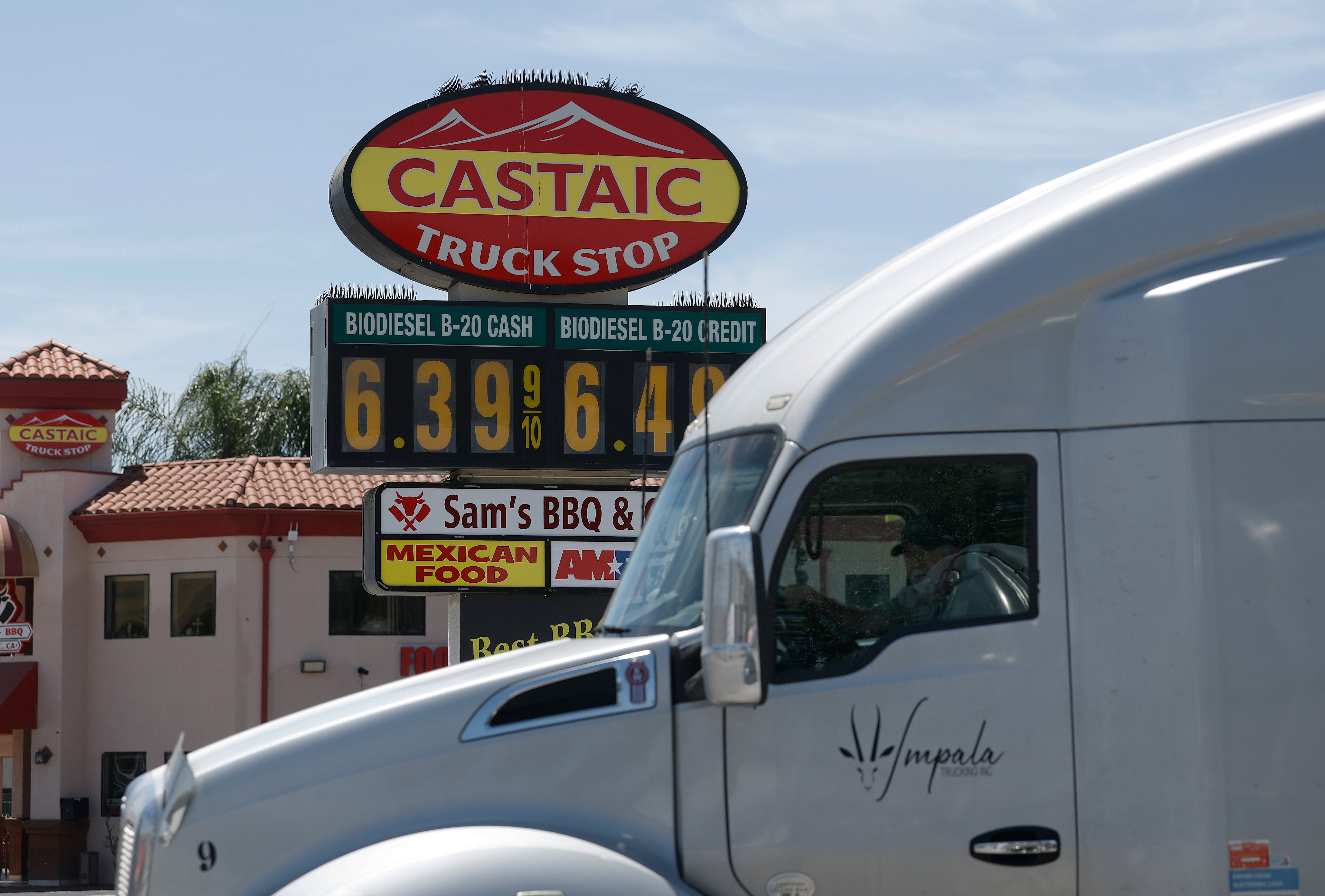 A truck drives by a sign displaying bio-diesel prices over $6 a gallon on June 03, 2026 in Castaic, California
