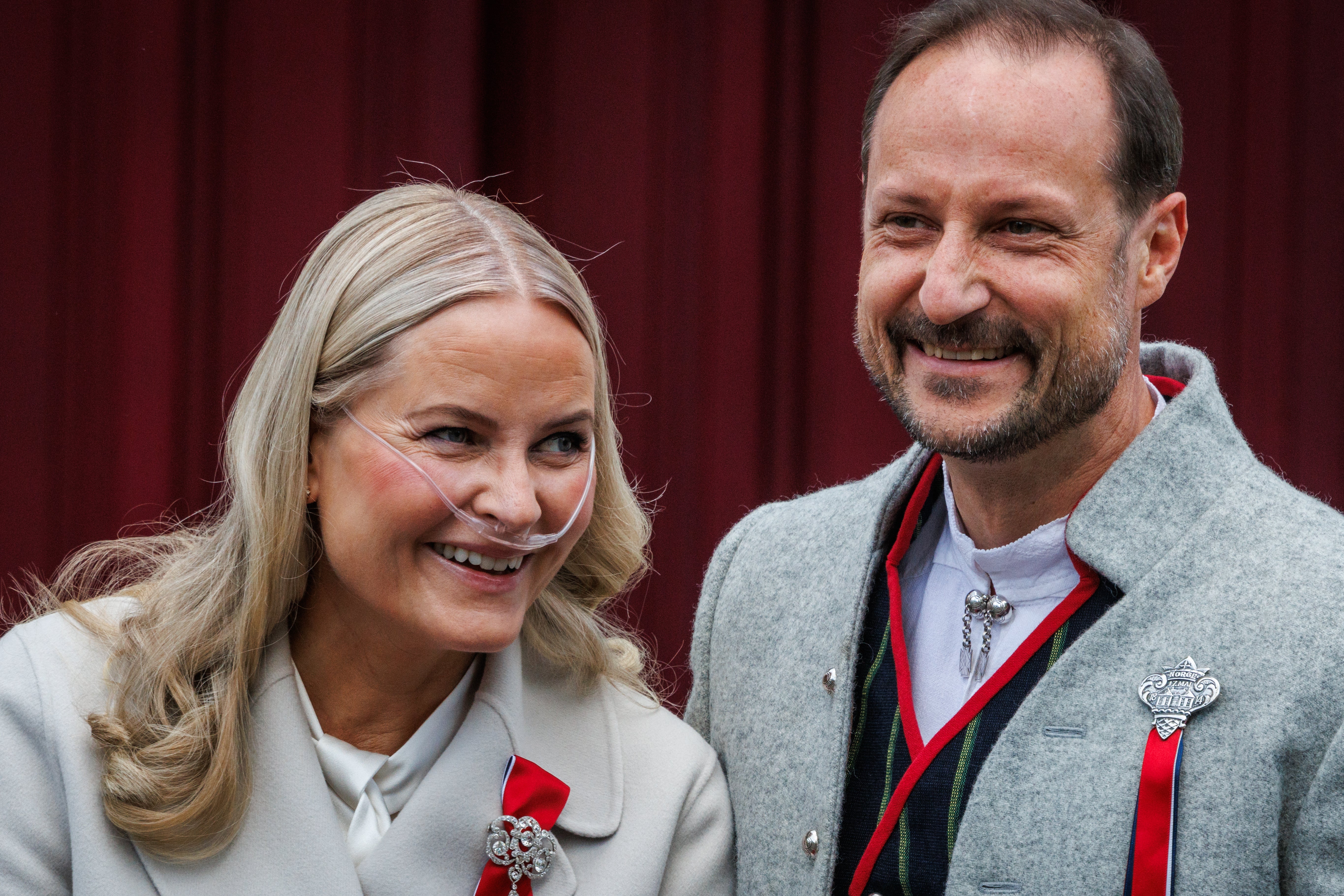 Crown Princess Mette Marit of Norway (L) and Crown Prince Haakon of Norway attend the Norwegian Constitution Day with the children's parade at their residence Skaugum on May 17