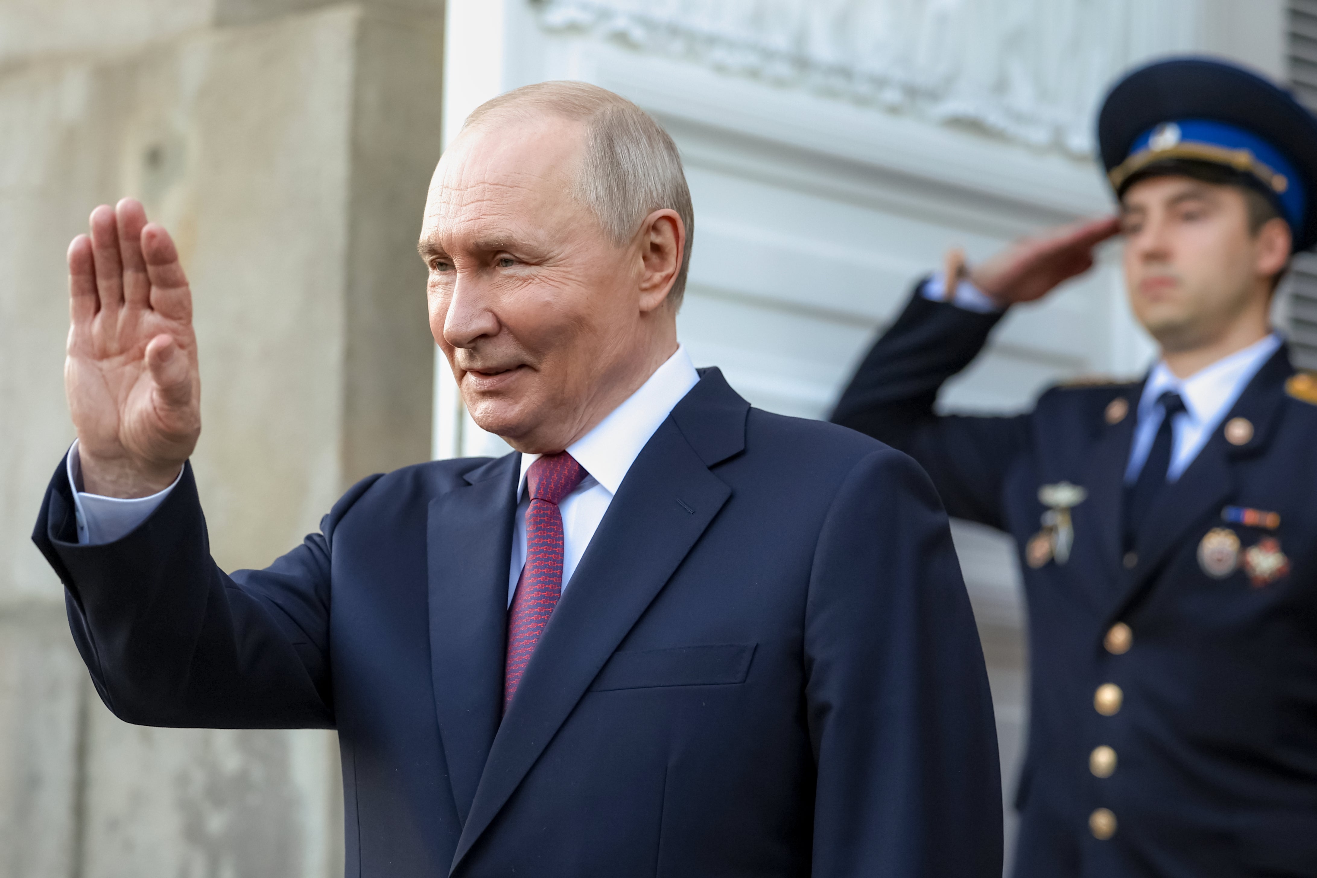 Russian President Vladimir Putin waves to Tanzanian President Samia Suluhu Hassan as she leaves the Grand Kremlin Palace of the Kremlin in Moscow, Wednesday, June 3, 2026