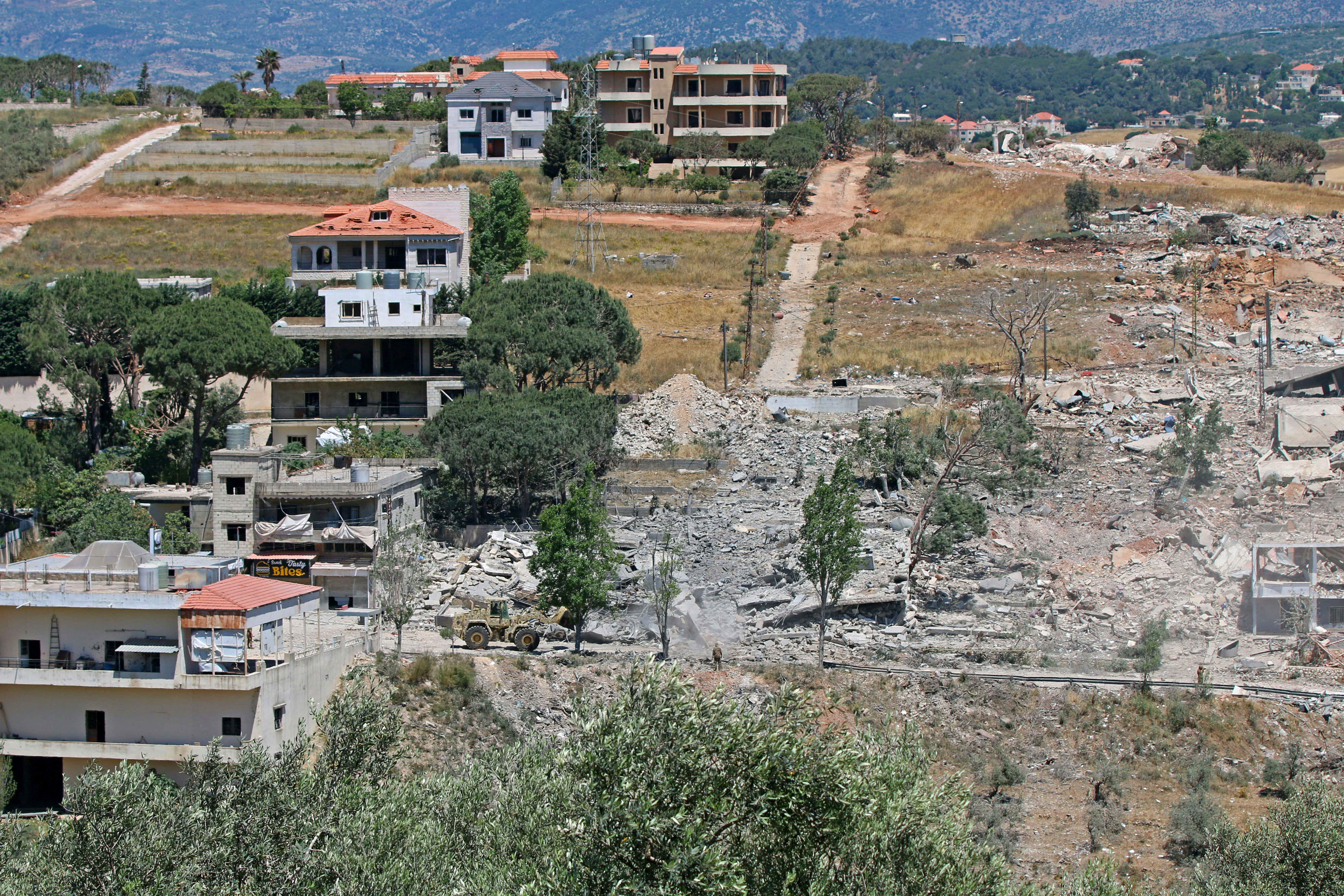 A Lebanese army bulldozer advances along the main road in the southern border village of Debbine on June 4, 2026, as the Israeli military reportedly begins a gradual withdrawal from the village. (AFP/Getty)