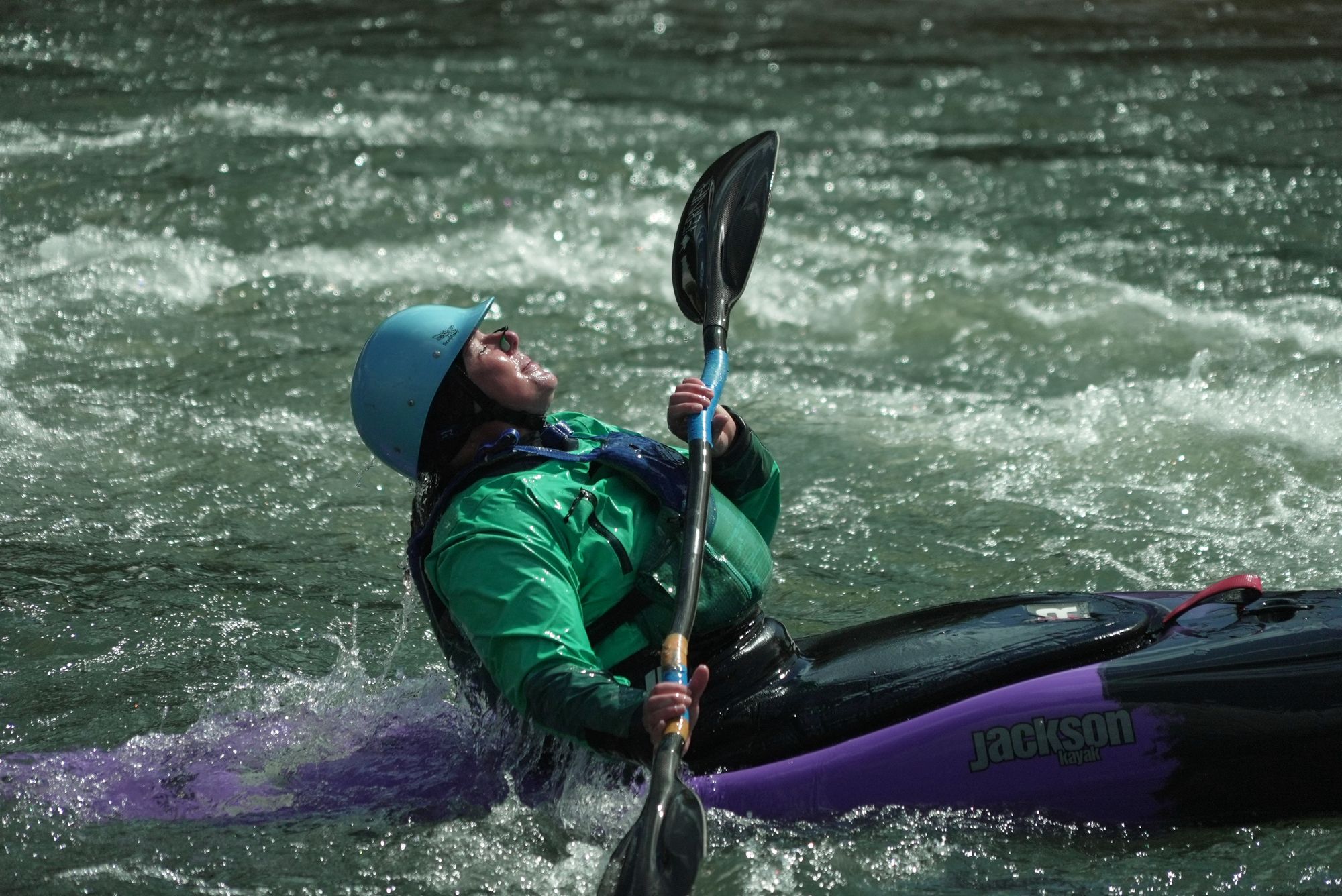 Hannah Ray J Childs kayaks at a whitewater park she helped create on the Maquoketa River Thursday, May 7, 2026, in Manchester, Iowa (AP Photo/Brittany Peterson)