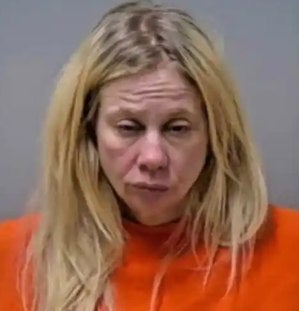 Shauna Rae Dokken, 43, of Roseau, Minnesota, allegedly told police that her dog distracted her and grabbed the steering wheel, causing the crash that killed Barbara Lee Welberg, 82