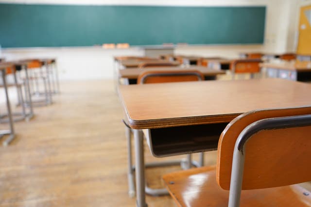 Teacher who let pupils watch TV and amended their coursework banned