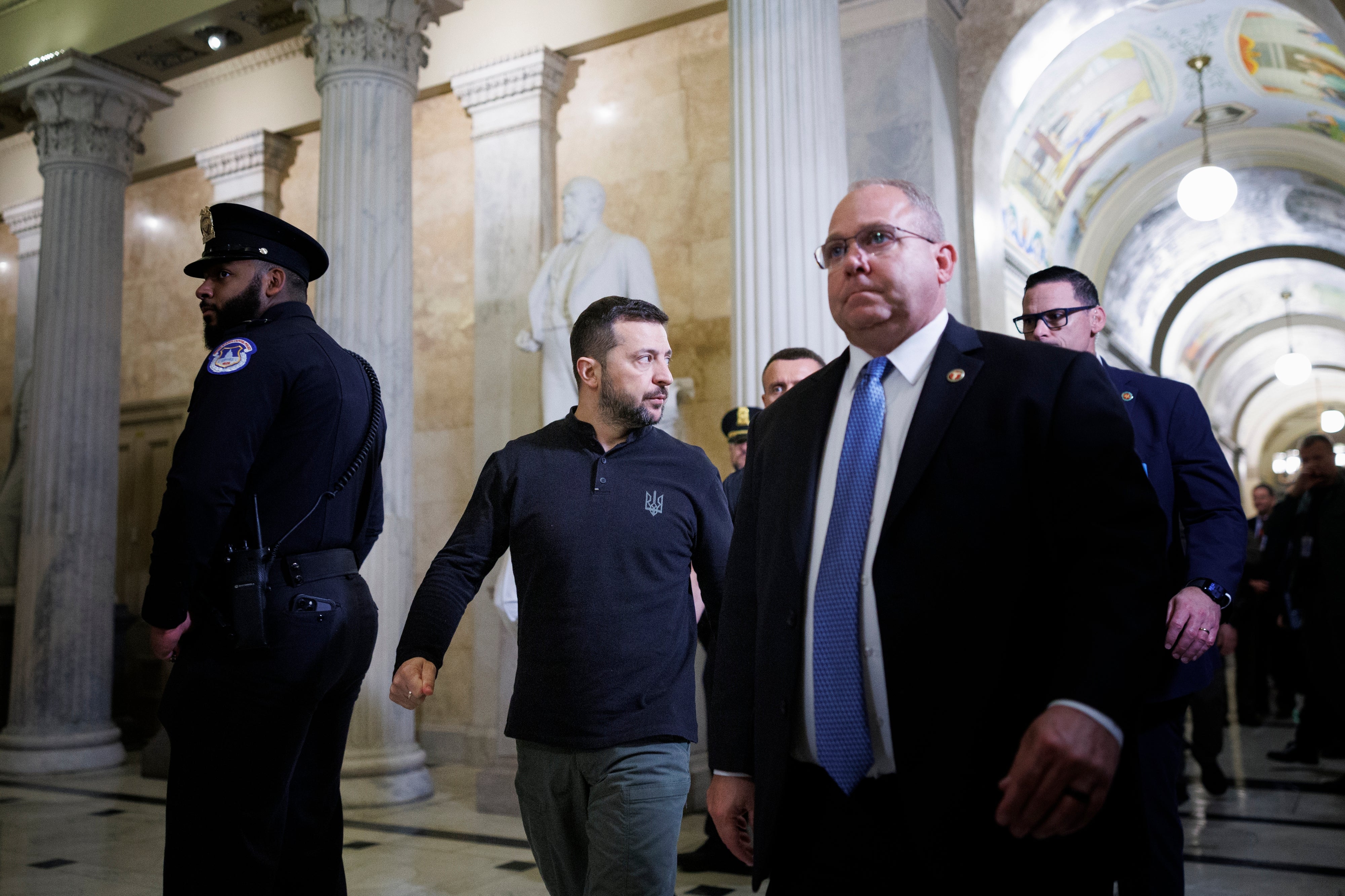 Ukrainian president Volodymyr Zelensky walks with staff and security members to a closed-door meeting with lawmakers at the US Capitol in 2024 (Getty)