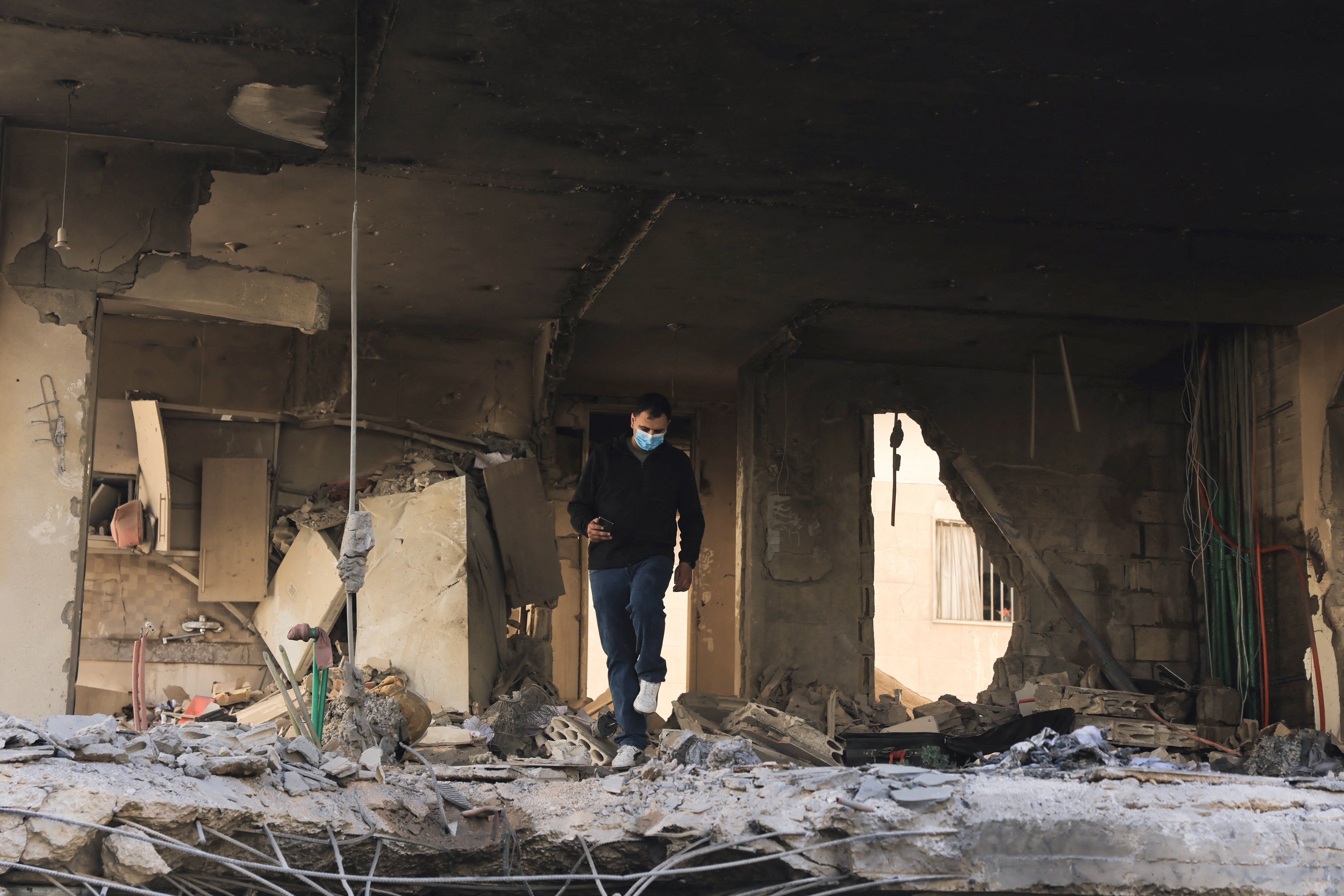 A man walks through a damaged building at the site of an Israeli strike on Beirut's southern suburbs, Lebanon, May 28, 2026.